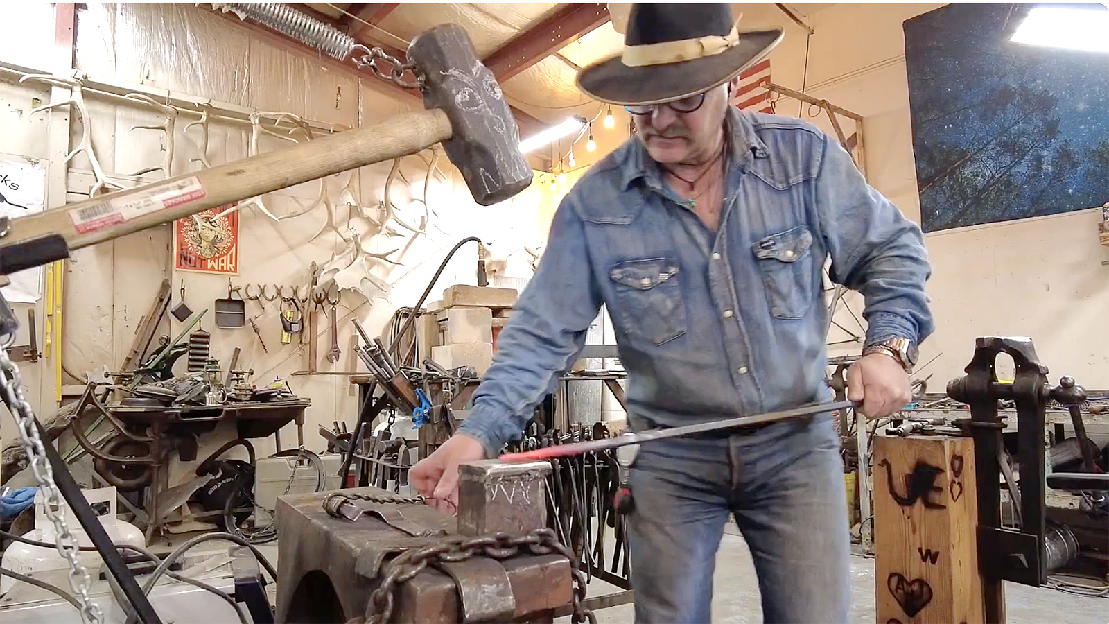 NJ Pawely working in his Cody, Wyoming, blacksmith shop.