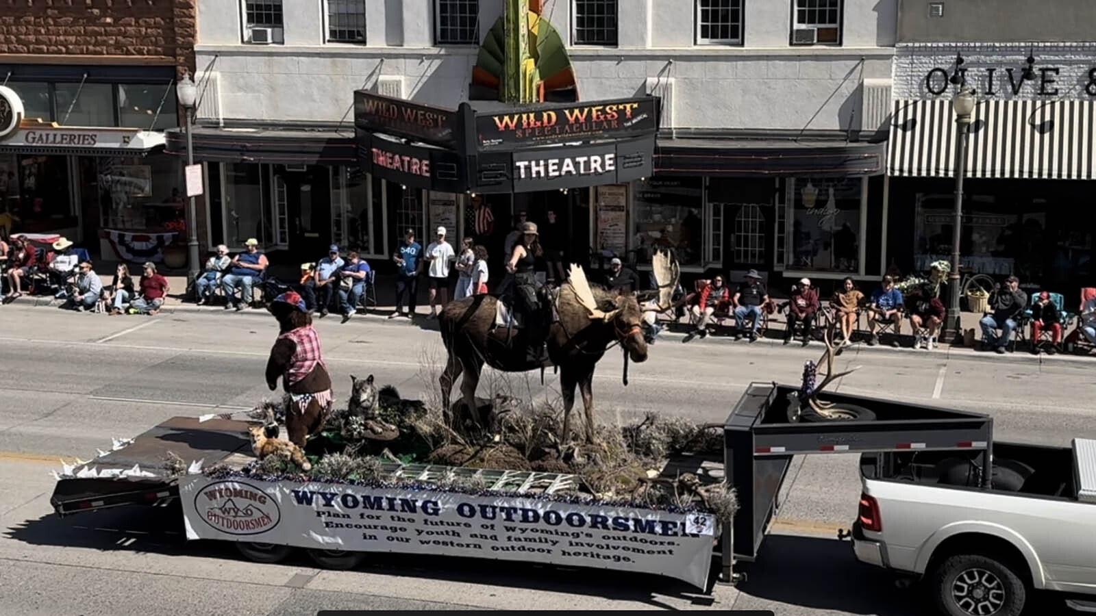 The Wyoming Outdoorsman present their moose-riding float to great acclaim during the Cody Stampede Parade on July 3, 2024.