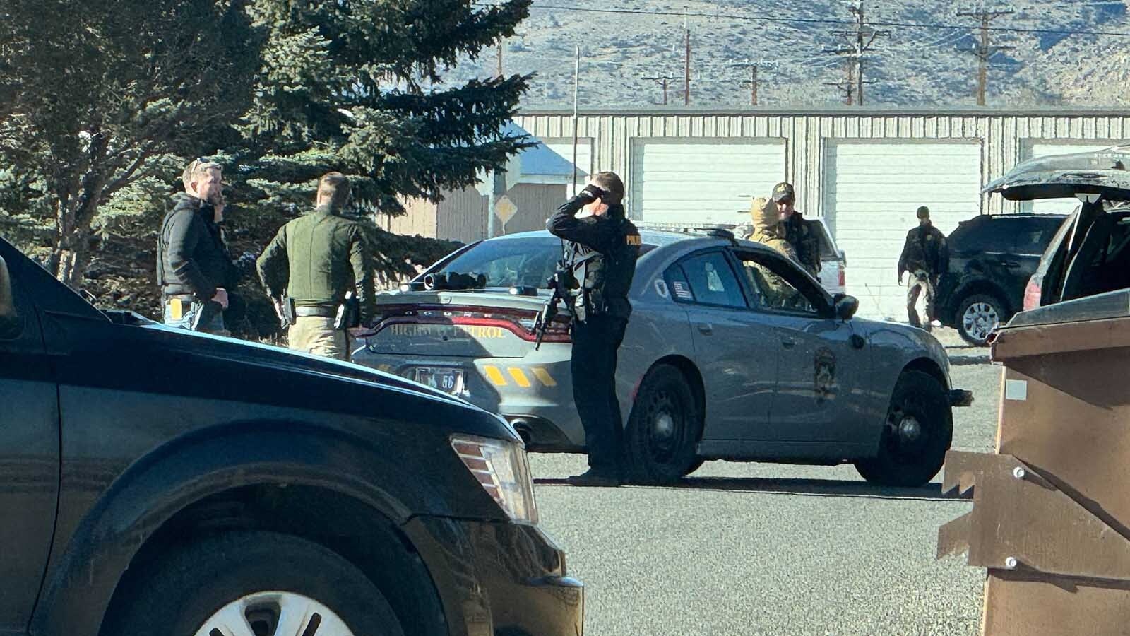 Multiple law enforcement agencies were engaged in an armed standoff with a suspect in a residential area of Cody on Wednesday that included shots being fired. The suspect was told over a loudspeaker to “come out with your hands up."