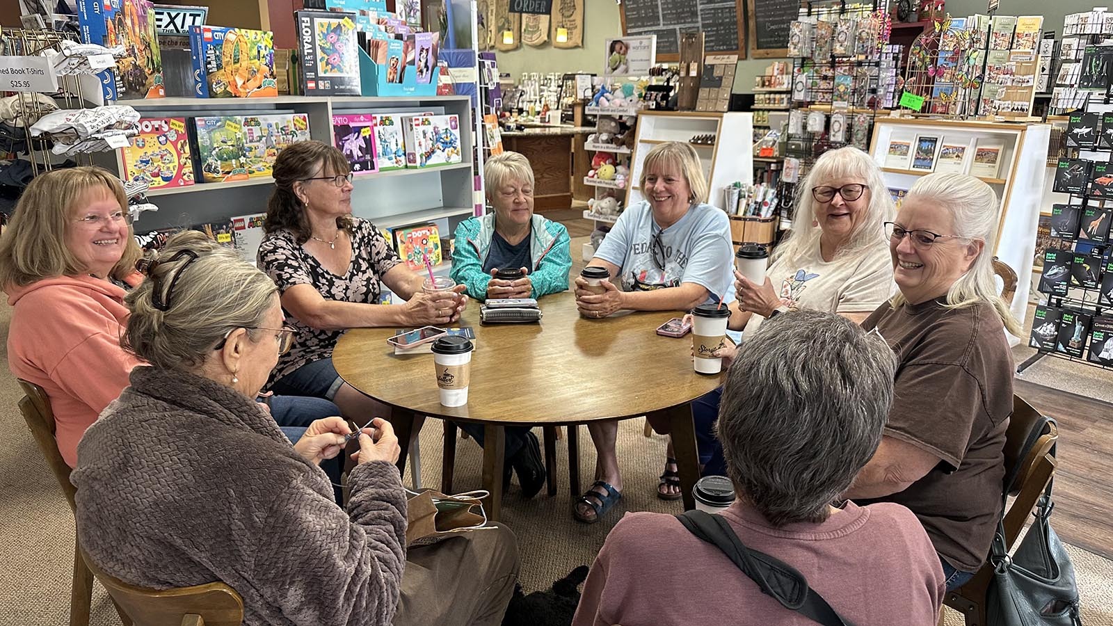 At the Storyteller and other businesses in Thermopolis, Wyoming, several different coffee groups meet each week. The table at the Storyteller is used each morning by a revolving group of women that includes retired teachers, Catholic ladies, a sewing group and yoga enthusiasts. Pictured are Tammy Redland, Joan LaFave, Trudy Brooks, Collette Anderson, Carol Biven, Meredith Russel.