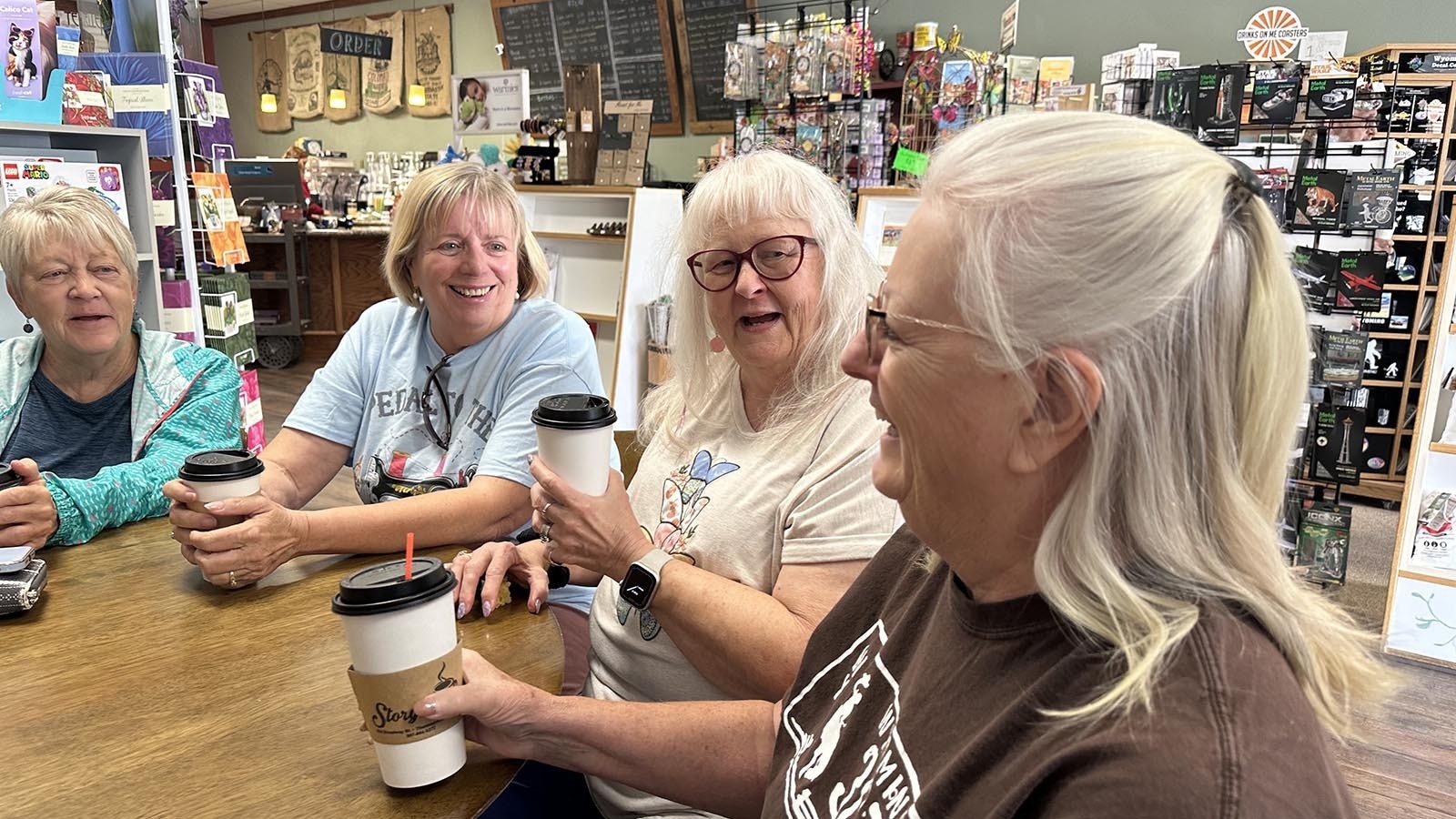 Trudy Brooks, Collette Anderson, and Carol Biven listen to another member of their coffee group during their weekly Tuesday morning meeting at the Storyteller in Thermopolis, Wyoming. Meeting like this, the women say, keeps them connected to their community and is a chance to just be social.