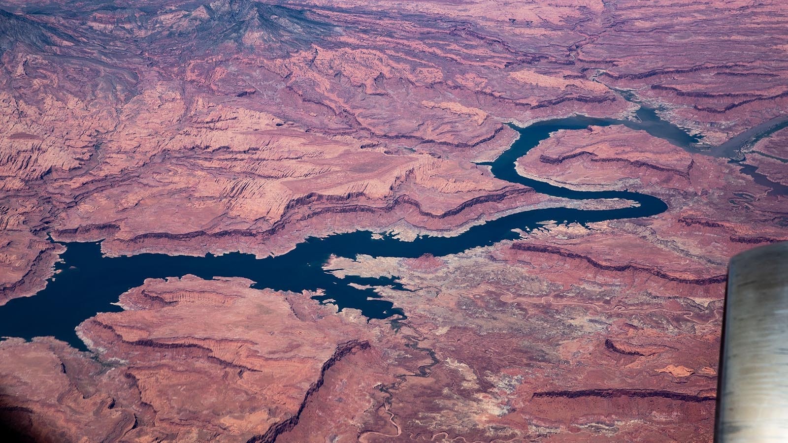 The Colorado River near White Canyon, Utah, is viewed from 37,000 feet on Sep. 1, 2023. The Colorado, flowing from Wyoming and the Rocky Mountains through Colorado, Utah, Arizona, Nevada and California, is heavily dependent on a winter snowfall.