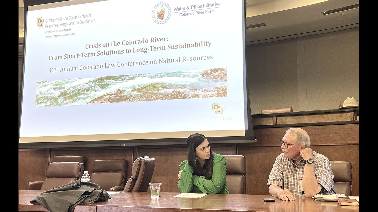 Wyoming rancher and former legislator Pat O’Toole chats with Meghan Scott, an attorney who helps farmers in Yuma, Arizona, during the “Crisis on the Colorado River conference Friday in Boulder, Colorado.