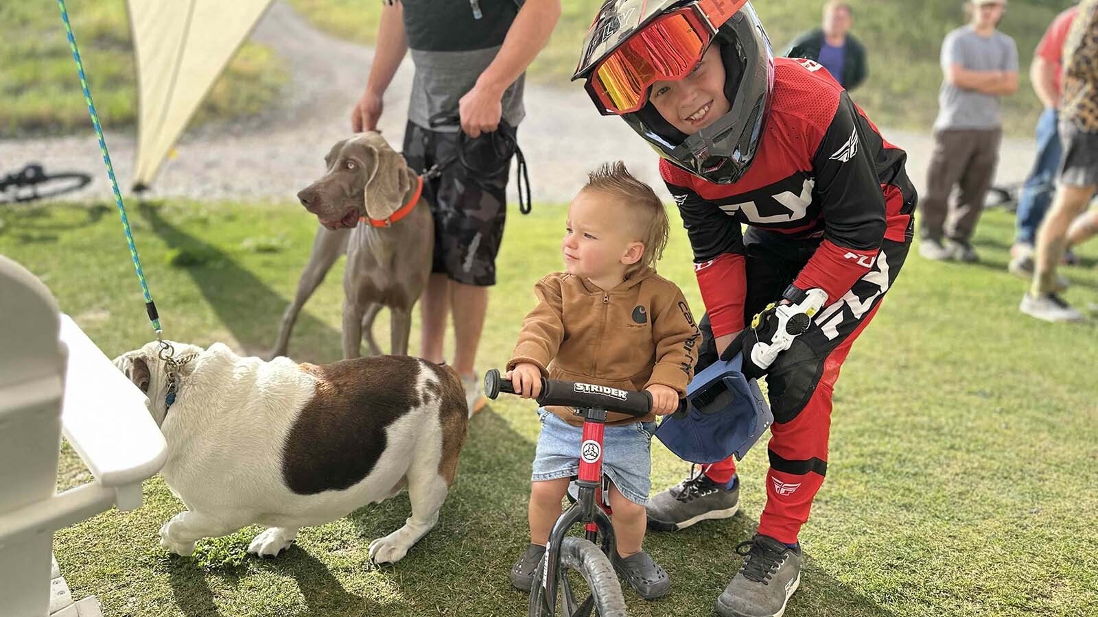 Young Bruce Cherry waits in the wings as his 10-year-old brother Cooper Cherry, right, from Idaho Falls placed 11th in the under 15 category.