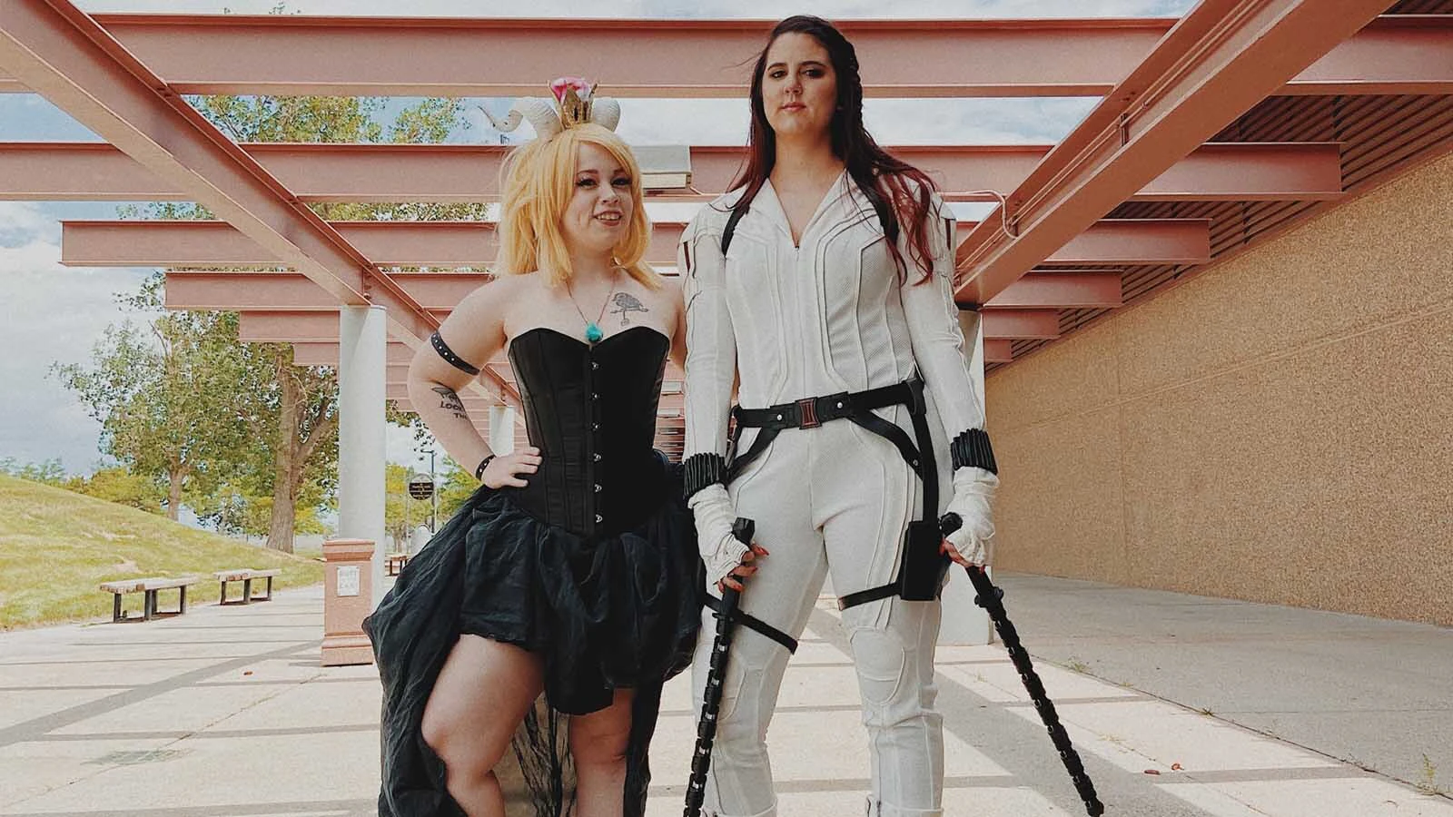 Two attendees show off their cosplay outside Casper Comic Con. Fans say the annual gathering offers a rare opportunity for Wyoming's comic, gaming and anime communities to come together.