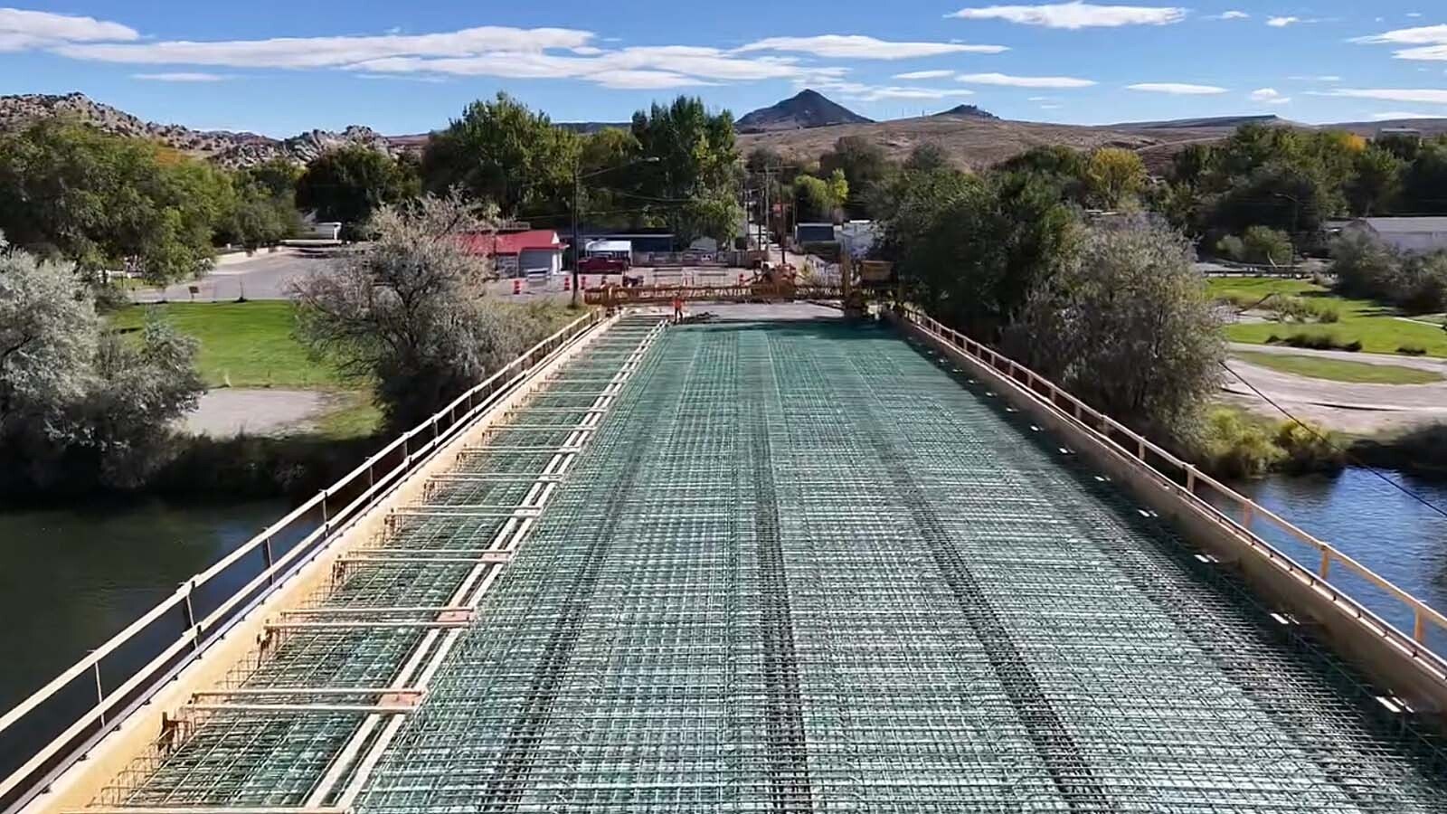 The Broadway Bridge spanning the Bighorn River in Thermopolis has been closed since July as it gets a major upgrade. On Thursday, crews from Canyon Concrete did a huge single pour of about 1.2 million pounds of concrete to cover it.