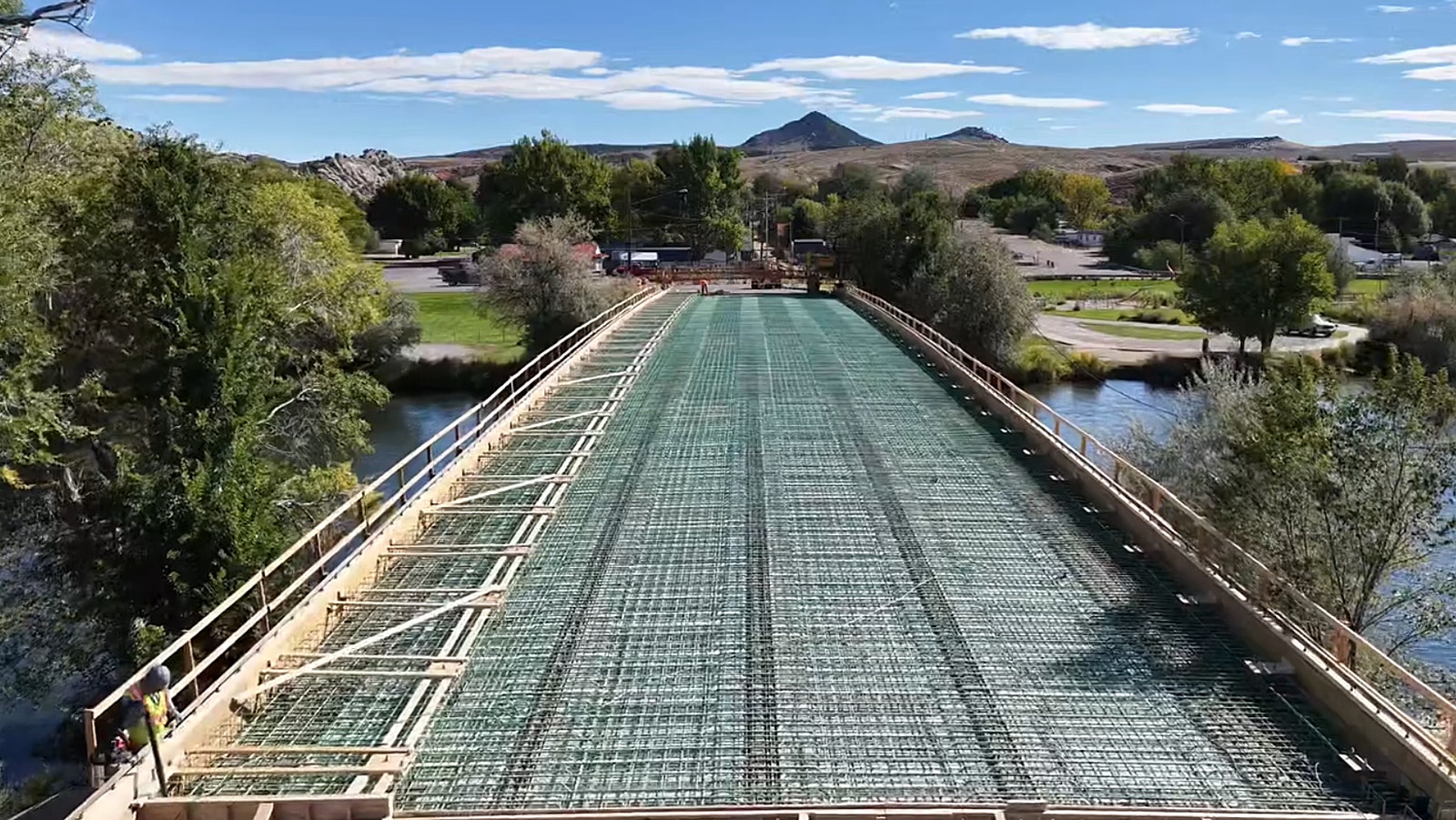 The Broadway Bridge spanning the Bighorn River in Thermopolis has been closed since July as it gets a major upgrade. On Thursday, crews from Canyon Concrete did a huge single pour of about 1.2 million pounds of concrete to cover it.