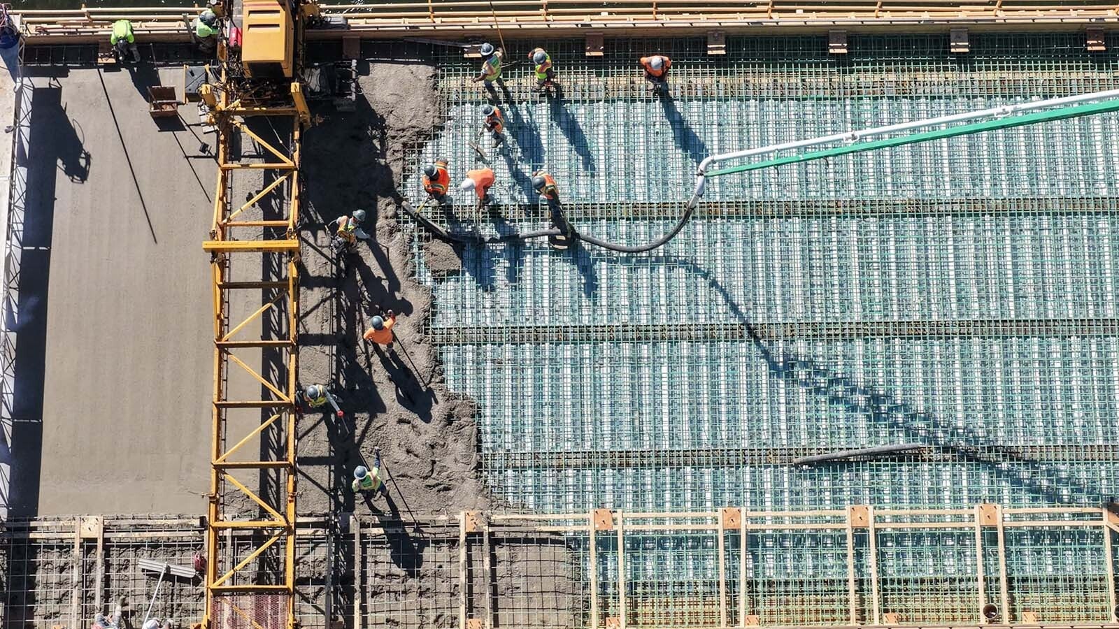 The Broadway Bridge spanning the Bighorn River in Thermopolis has been closed since July as it gets a major upgrade. On Thursday, crews from Canyon Concrete did a huge single pour of about 1.2 million pounds of concrete to cover it.