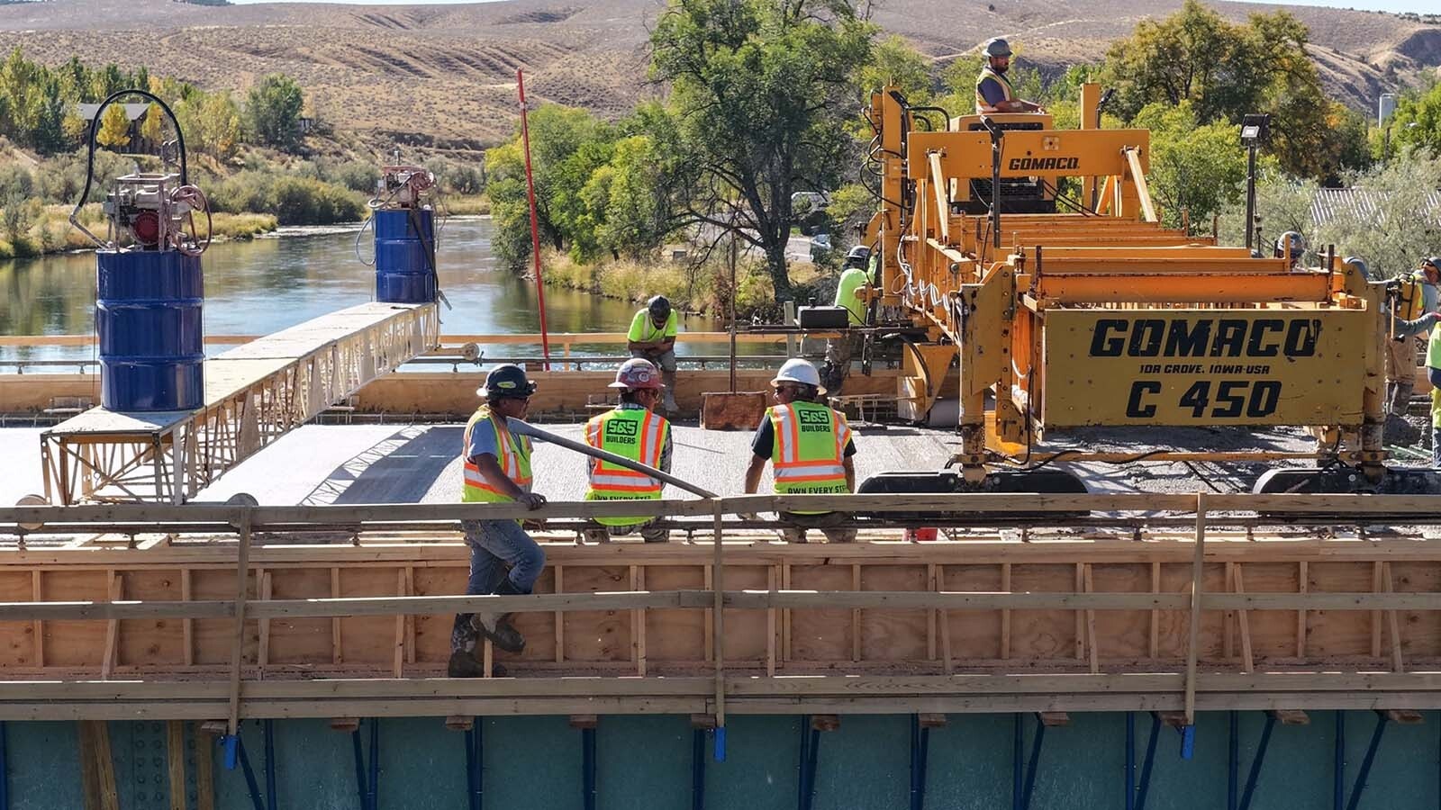 The Broadway Bridge spanning the Bighorn River in Thermopolis has been closed since July as it gets a major upgrade. On Thursday, crews from Canyon Concrete did a huge single pour of about 1.2 million pounds of concrete to cover it.