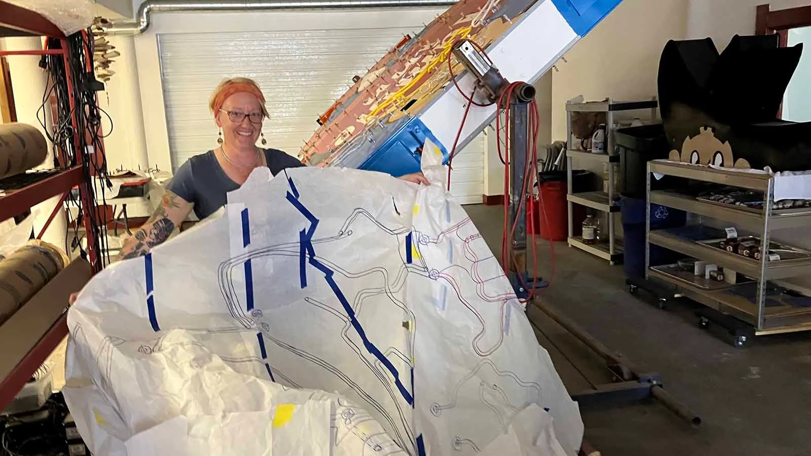 Connie Morgan holds up her pattern for all the light needs on the cowboy sign.