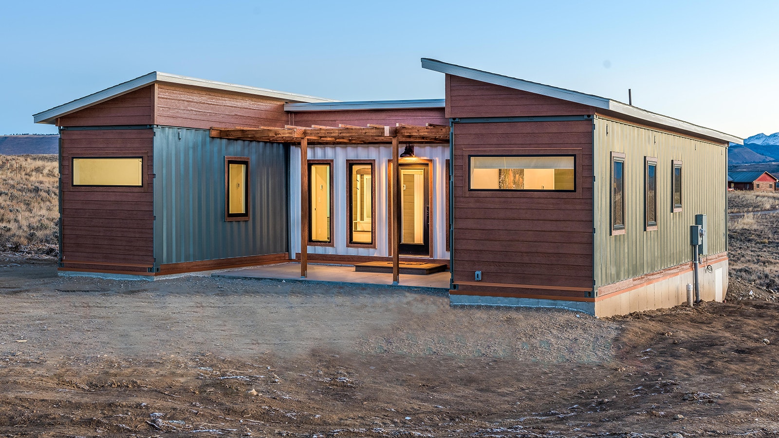 This 800-square-foot home is built from three steel shipping containers in an H configuration.