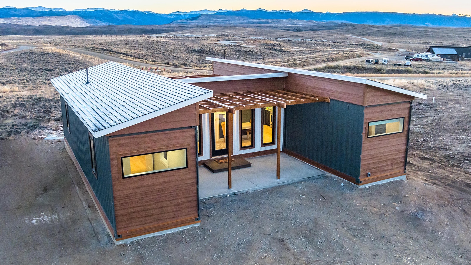 This 800-square-foot home is built from three steel shipping containers in an H configuration.