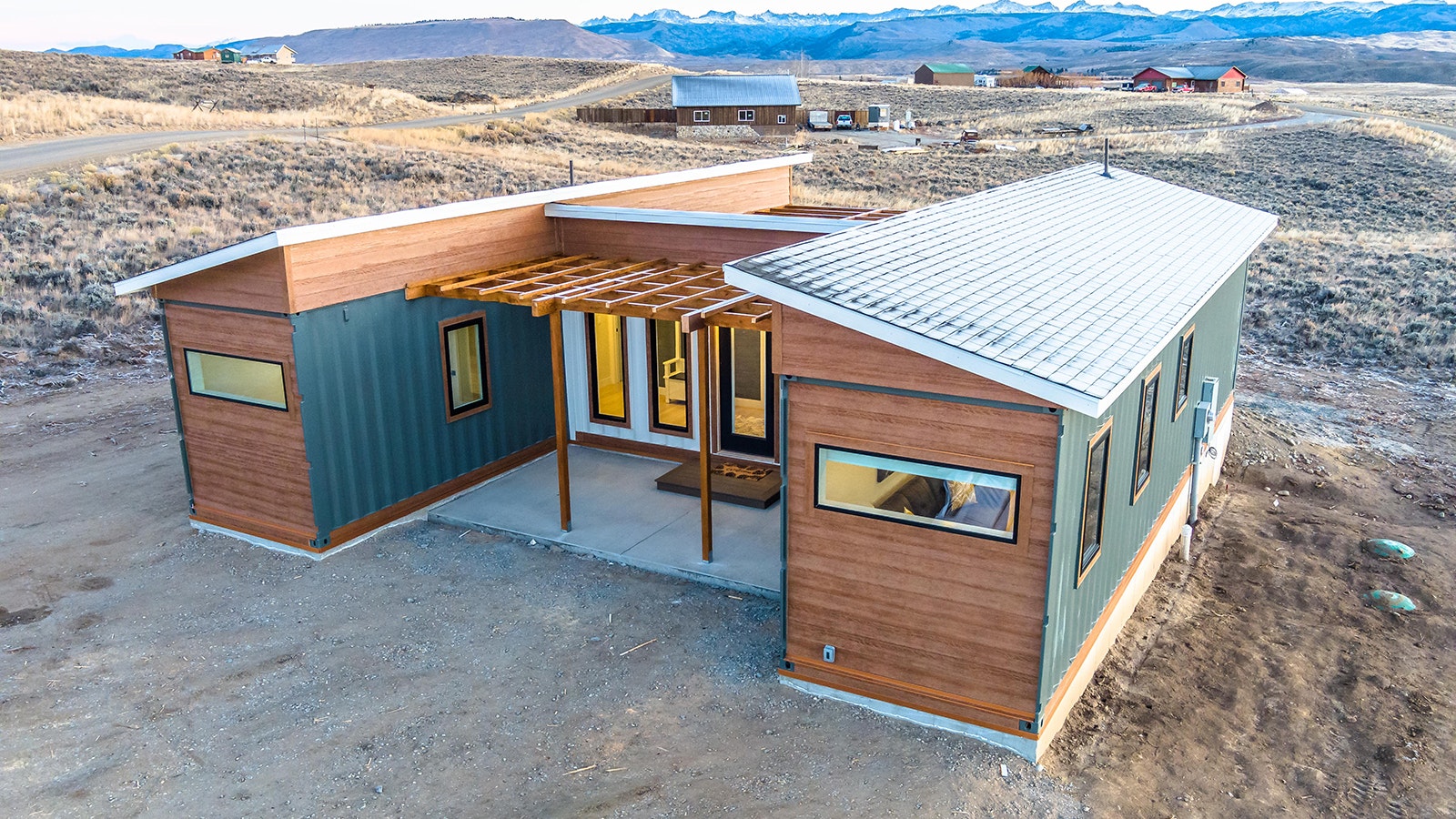 This 800-square-foot home is built from three steel shipping containers in an H configuration.