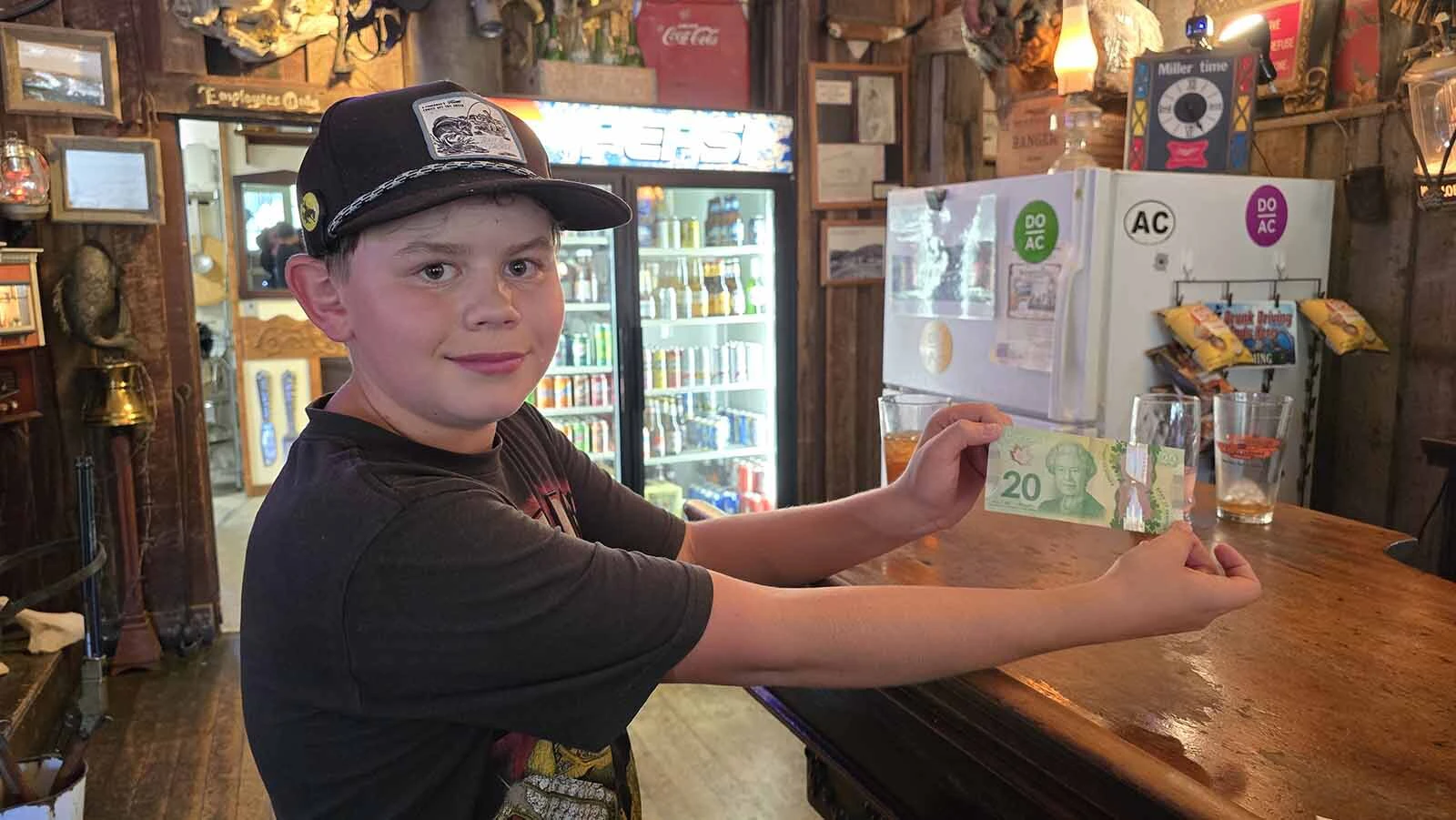 Logan Freeman shows off his newest acquisition from a Continental Divide bike packer. It's a Canada $20 bill. Thanks to international tourists finding their way to Atlantic City along the Continental Divide, Freeman's collection has lots of different currencies.