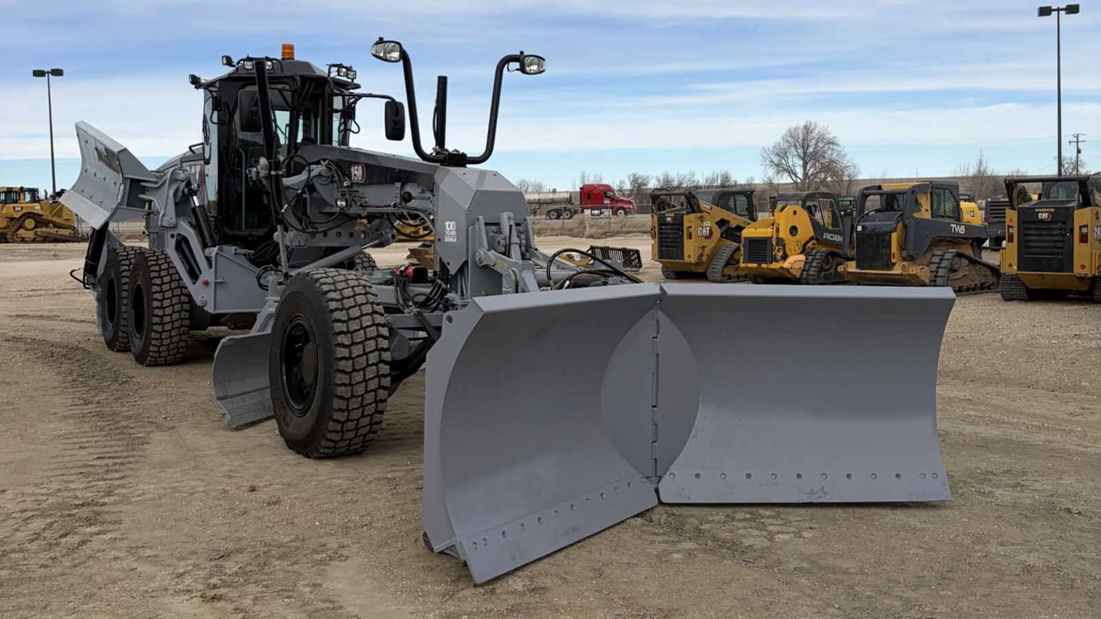 Converse County recently bought two new road graders, in Caterpillar's historic battleship gray color. The county also got from the company for free a special 100th anniversary blade to put on them, one of only five in the world.