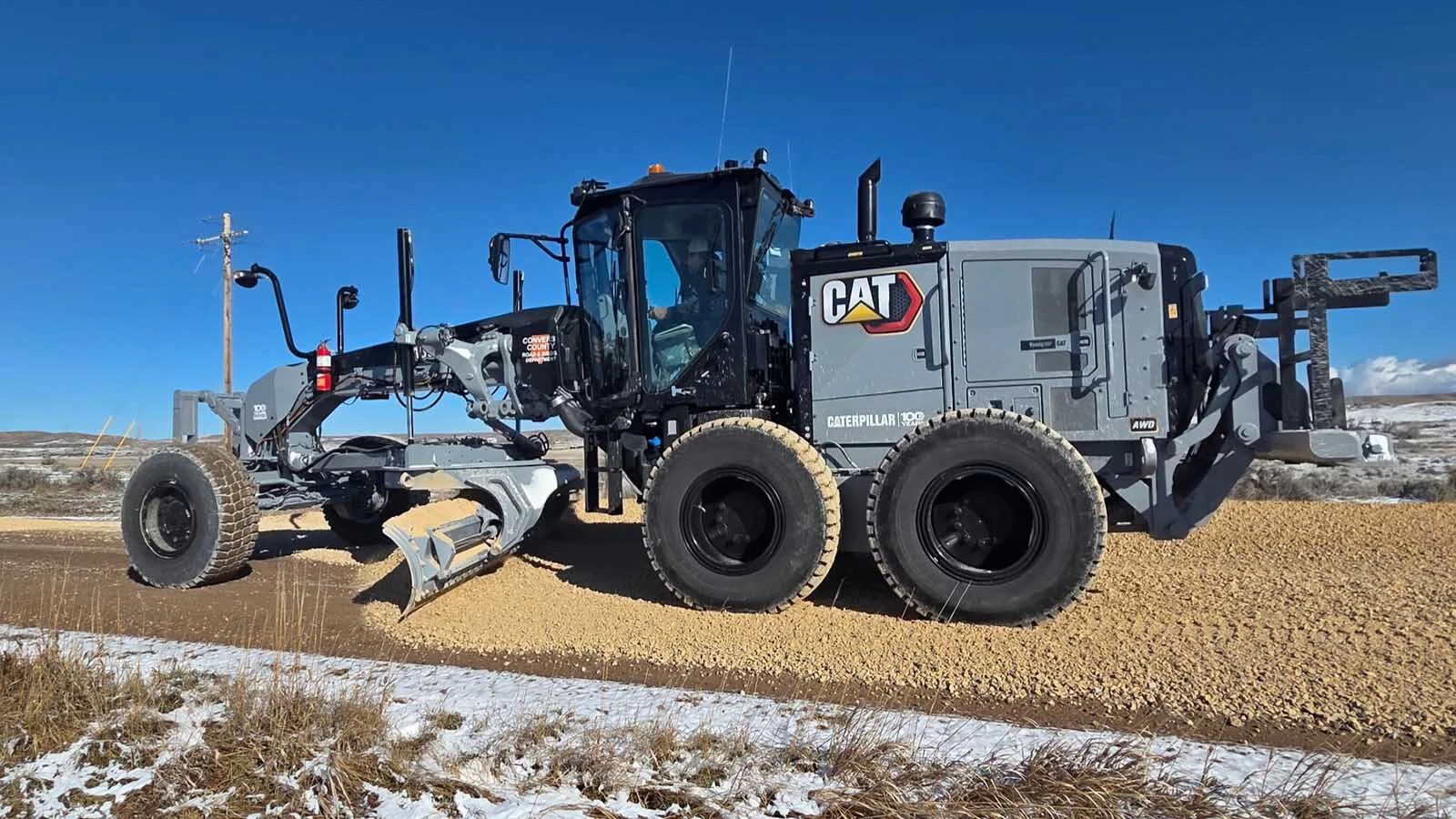 Converse County recently bought two new road graders, in Caterpillar's historic battleship gray color. The county also got from the company for free a special 100th anniversary blade to put on them, one of only five in the world.