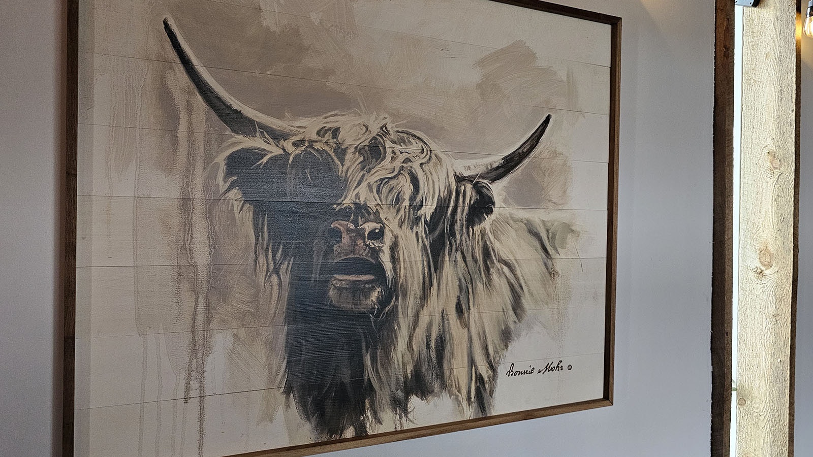 Photos and artwork of Audra Dominguez's coo abound in her coffee shop, Audra's Copper Coo.