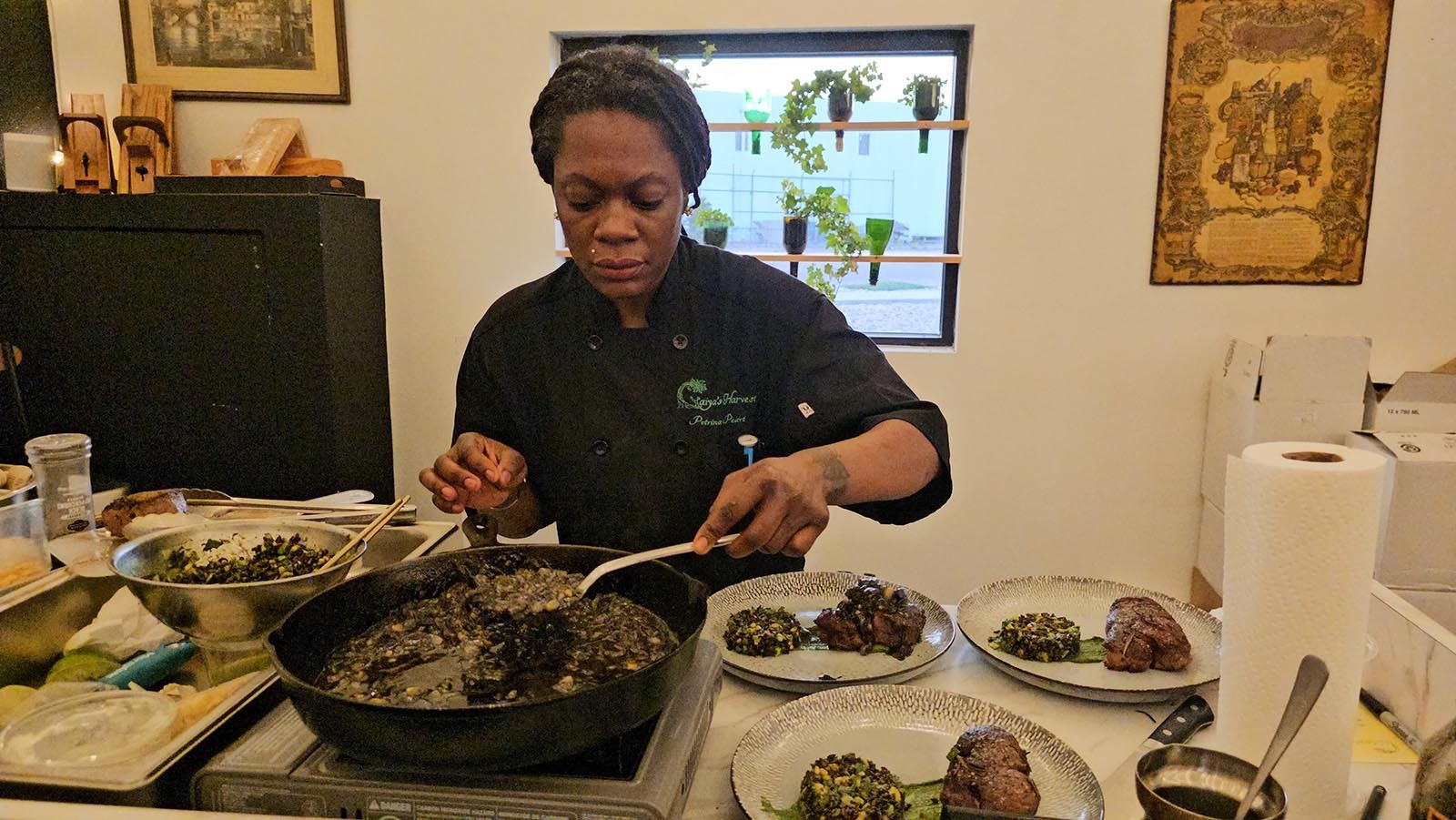 Chef Petrina Peart scoops up a generous spoonful of huitlacoche to top each delicious steak.