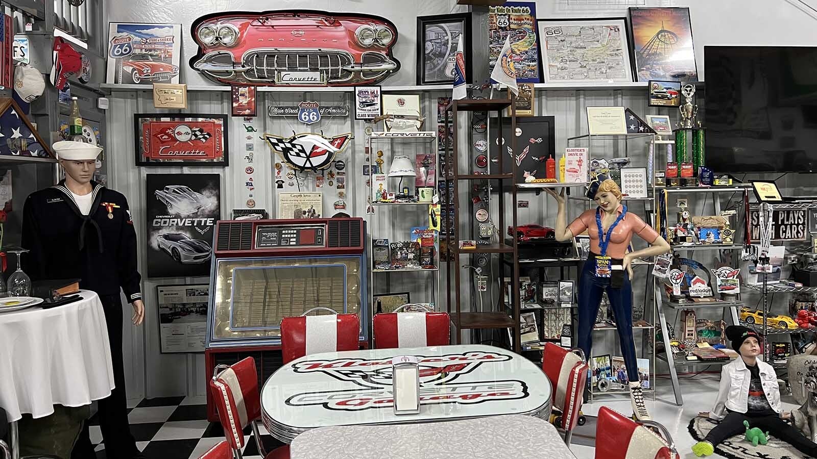 Larry Kloster’s garage features his large collection of Corvette memorabilia, the Corvettes themselves and a variety of other collectible items. He opens his doors to various events throughout the year to share his collection and meeting area with others.