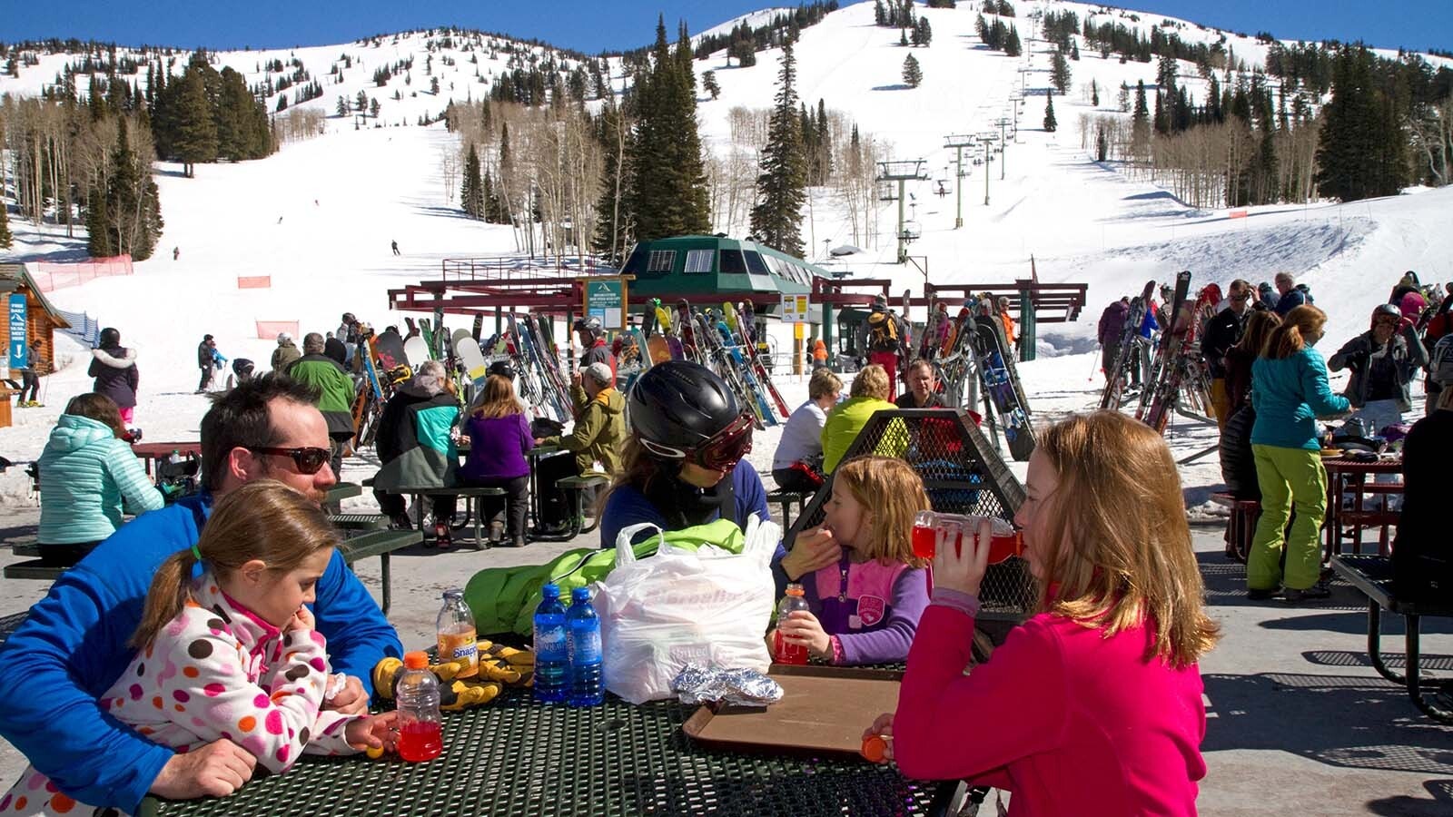 Small resort owners are fighting to keep skiing affordable as major mountains push daily tickets to record highs. It’s forcing skiers to buy single-day tickets that cost as much as some used to pay for a full season pass. Here a sunny day draws a crowd at Grand Targhee Resort in Alta, Wyoming.