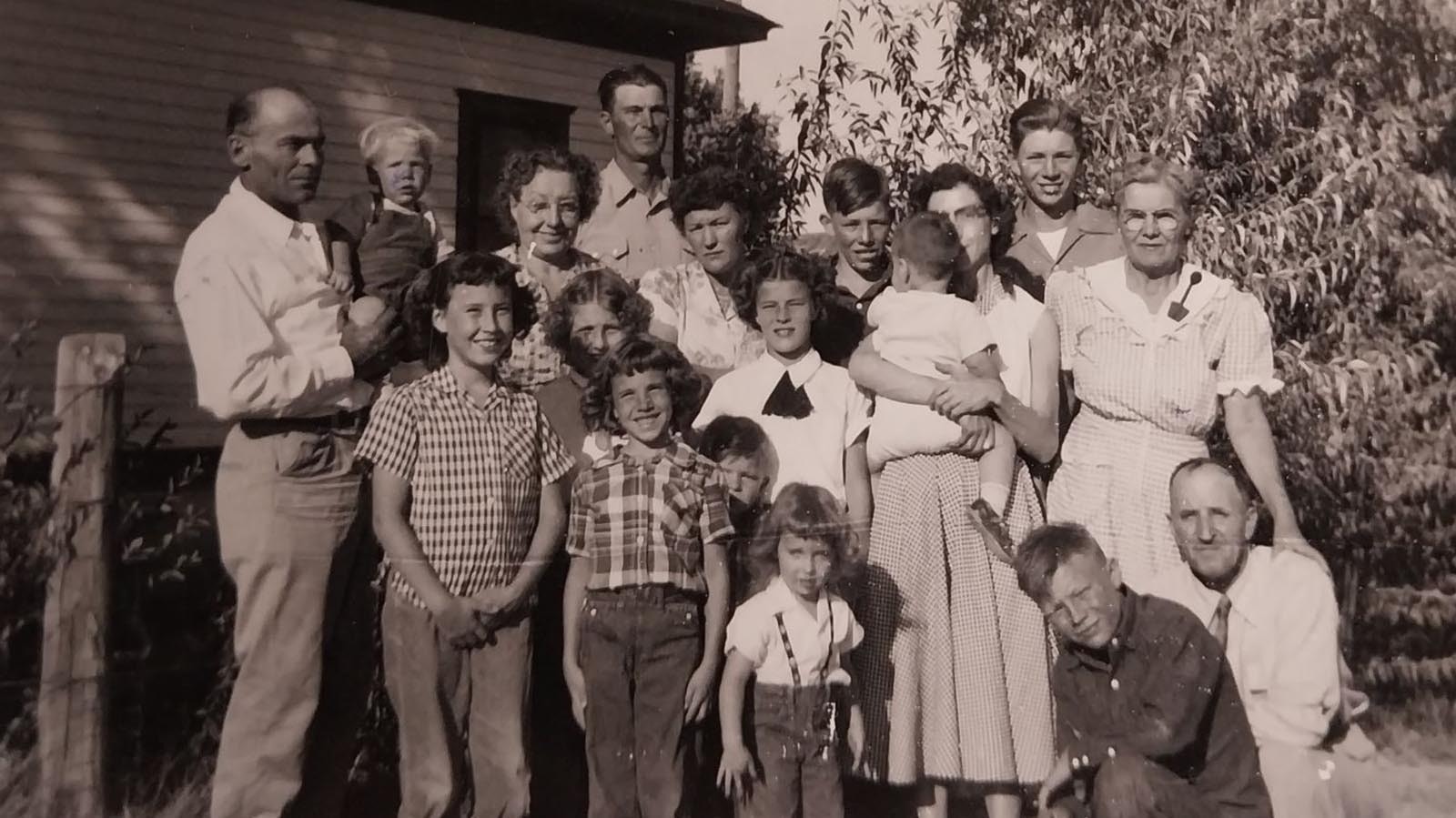 Members of the Lauber, Herman, and Akers families pose for a photo. Glenda Wiken is in plaid shirt, second from left in front row.