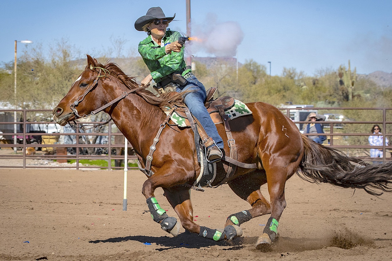 Most horses, as well as competitors, use ear plugs in the sport of cowboy mounted shooting. Notice them here on Kenda Lenseigne's horse.