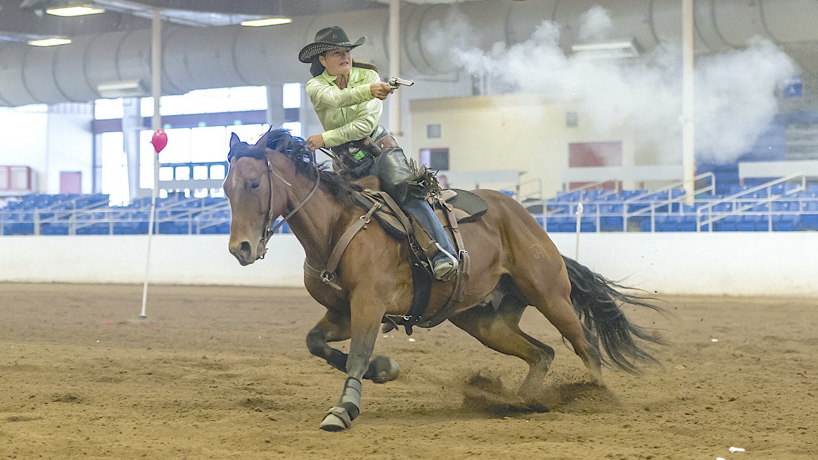 Lisa Grimsley of Star Valley hosted the first mounted shooting event in western Wyoming in 2016. She's pictured here shooting from her horse, Syngyne McCall.