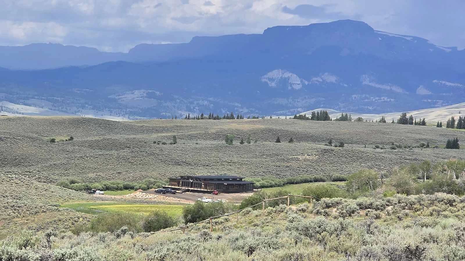 The Cowboy Starship is surrounded by the Absaroka Mountains and the Wind River Range.