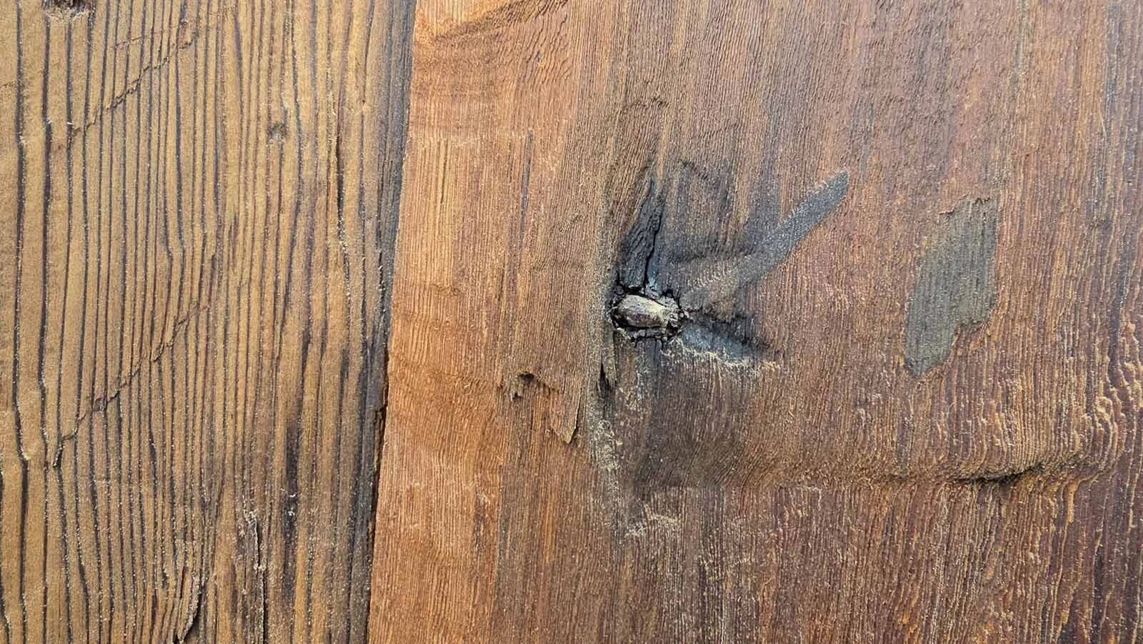 The reclaimed wood still has 1800s-era square-head nails.