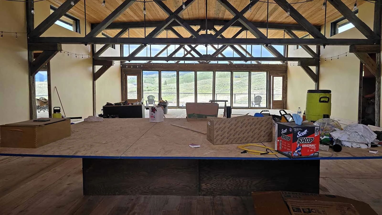 The bar is going here, where this plywood is holding tools and other items for construction workers.
