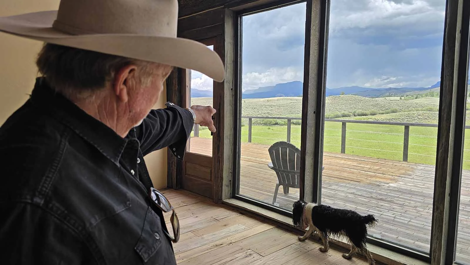 Gary Engman points to the area where he saw a mama grizzly bear and cubs playing Wednesday.