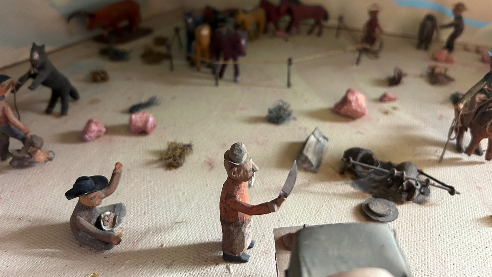 A diorama shows life around the chuck wagon with figurines carved by Bill Evans.
