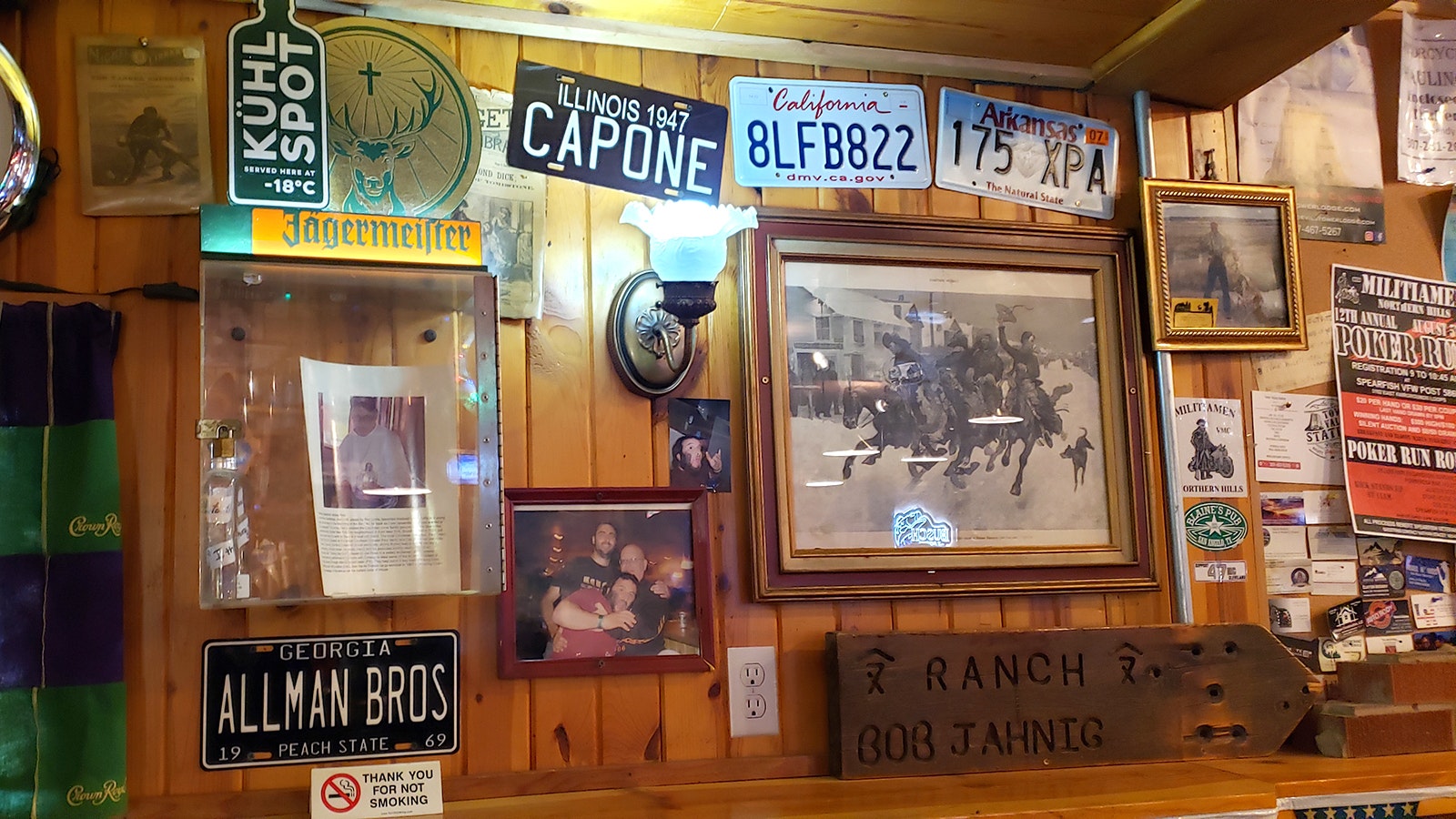 License plates photos and Henry Hill's whiskey flask.