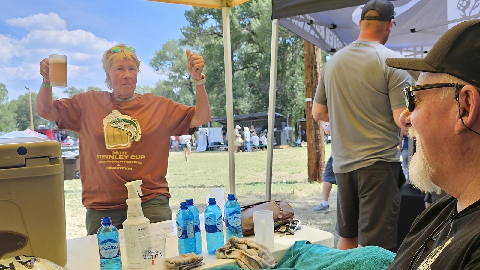 Mitch Kunce, brewer at The Library in Laramie, talks with a fan of his blueberry-pomegranate beer.