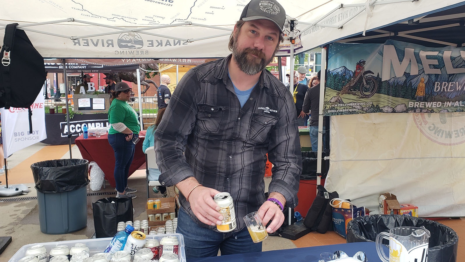 Luke Bauer pours a sample at the recent Wyoming Brewers Festival.