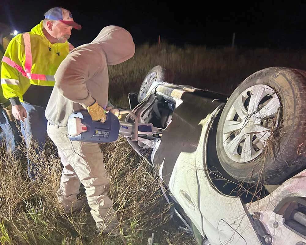 Responders work to extricate Alyson Swanson from her overturned vehicle after an early Monday rollover in northwest South Dakota.