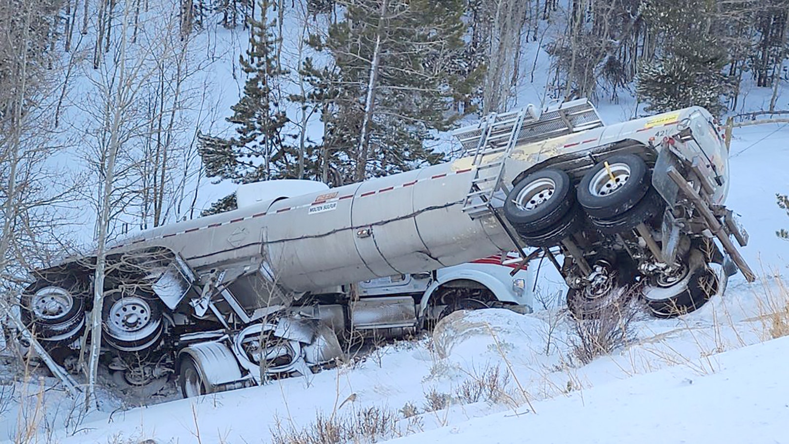 A semitrailer carrying 114,000 pounds of liquid sulfur slid off Highway 28 and down a 200-foot embankment during the Thanksgiving weekend blizzard.