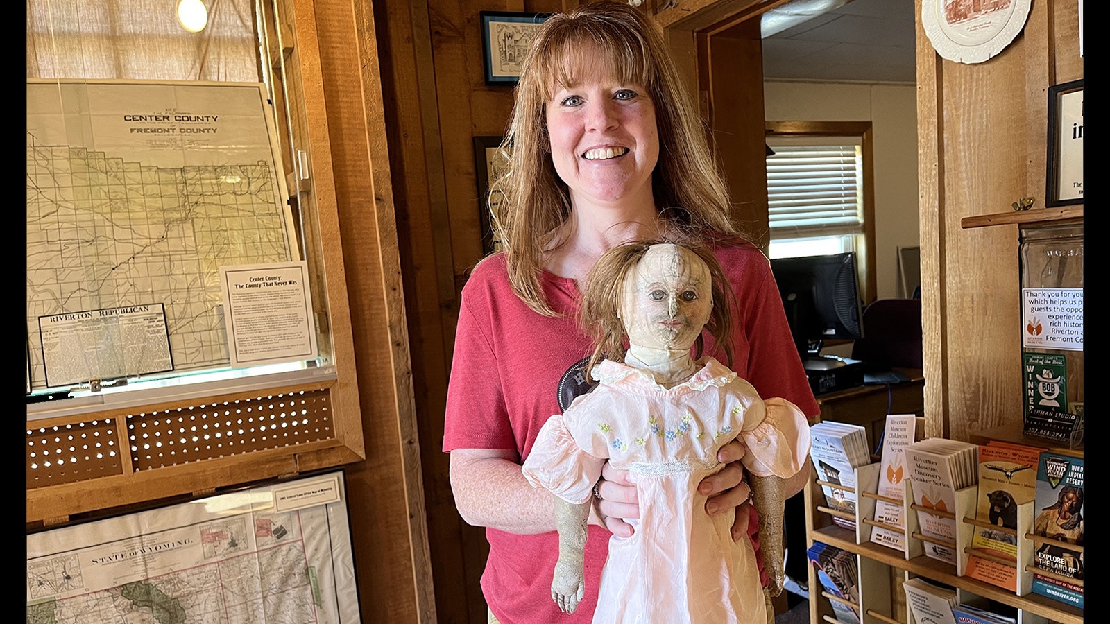 April Peregoy works at the Riverton Museum and holds Amelia, which might be the creepiest doll in Wyoming.