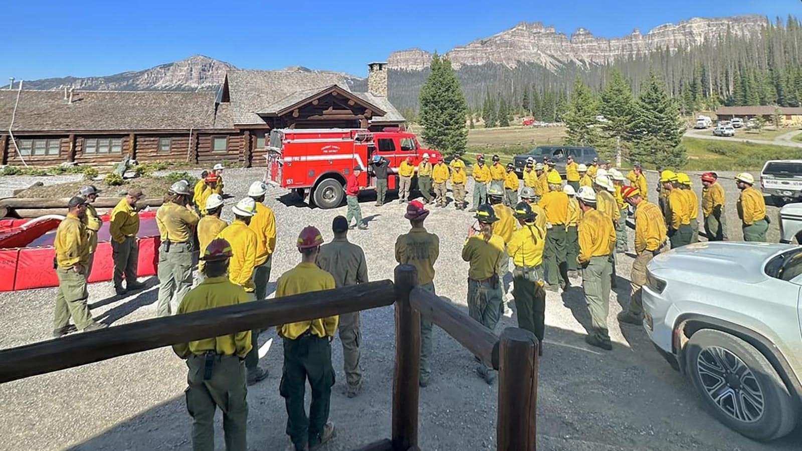Dozens of firefighting crews are on site at the Brooks Lake Lodge to protect the historic site as well as train for fighting the Fish Creek Fire in August 2024 if or when it advances close to residential areas.