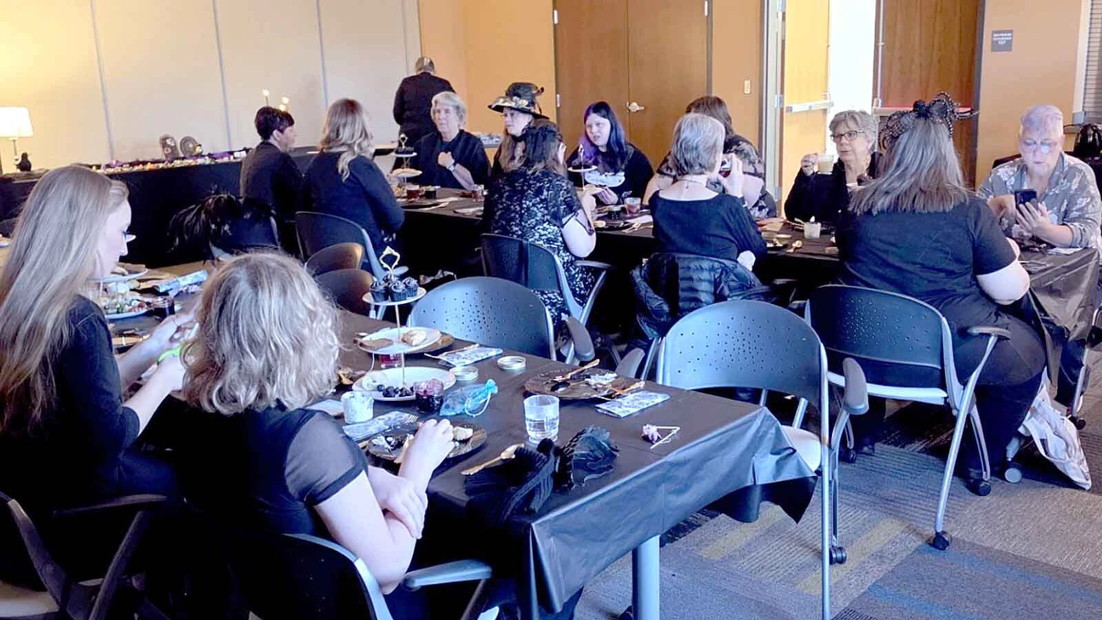 About 20 adults gather over tea, treats and conversation during the Adult Crow Tea at the Converse County Library in Douglas on Sunday.