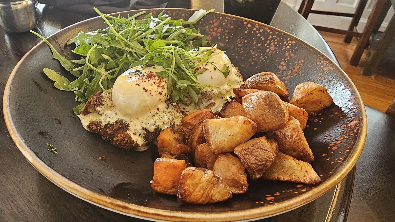 After enjoying the Frozen Dead Guy tour, the nearby Brunch and Co. offers a great breakfast. Here, the Grady Twins breakfast, which is two poached eggs on crab cakes, served with salad greens and potatoes.