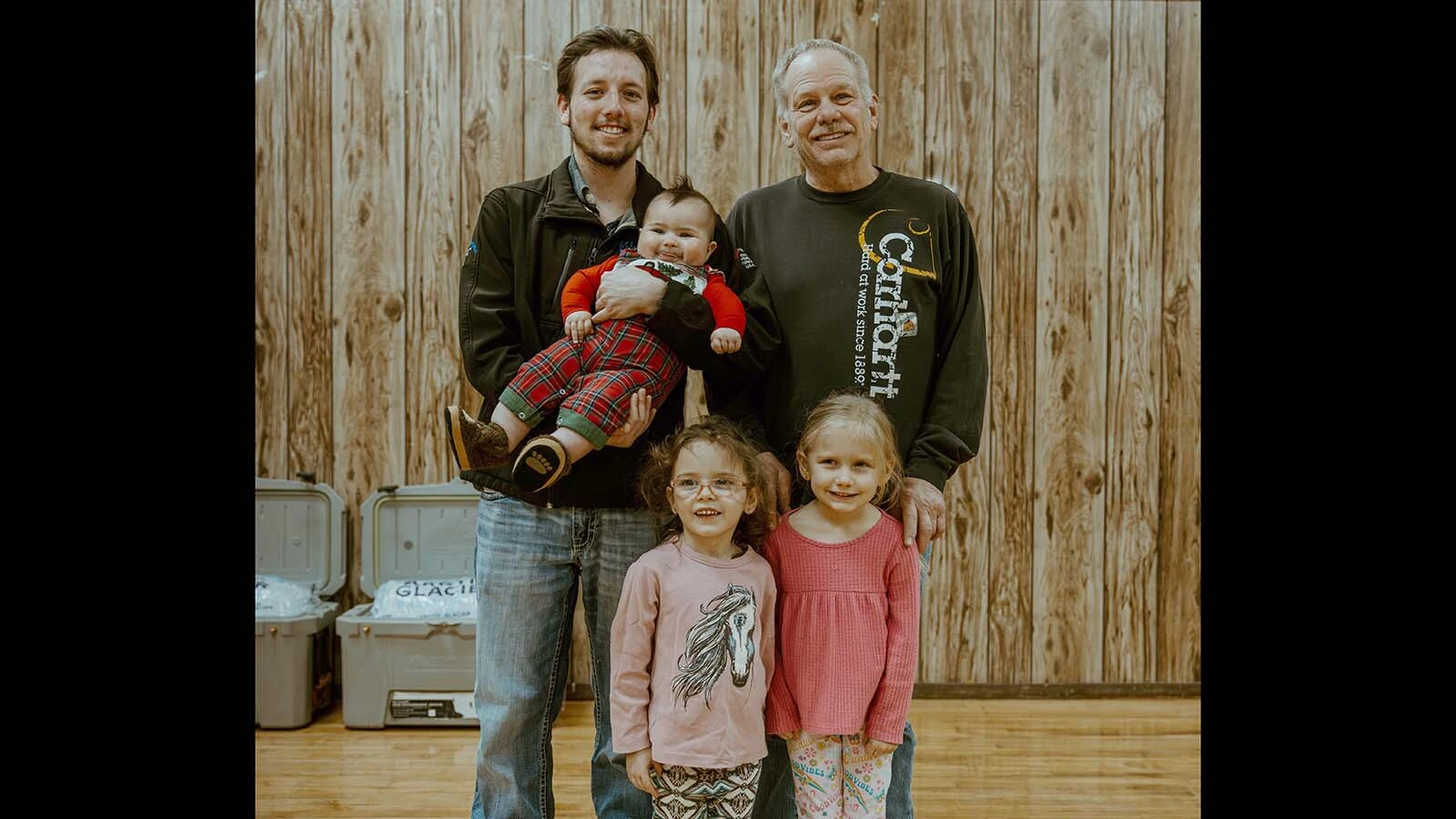 Curt Hjorth, top right, with his son Derek and grandkids.