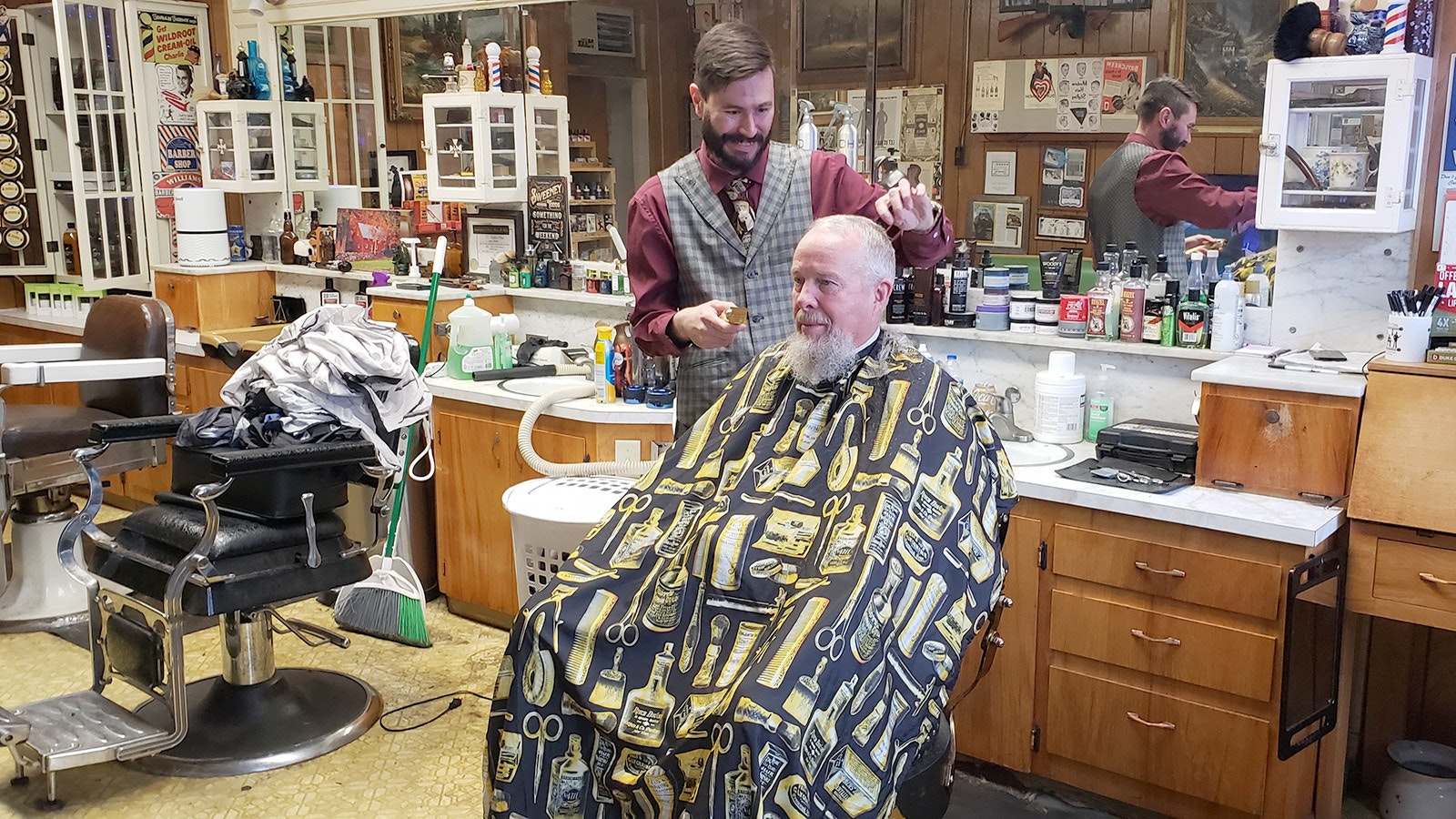 Kurt Matthew Wheeler gives Kyle Swander his usual haircut at Kurt's Cuts in Lovell.