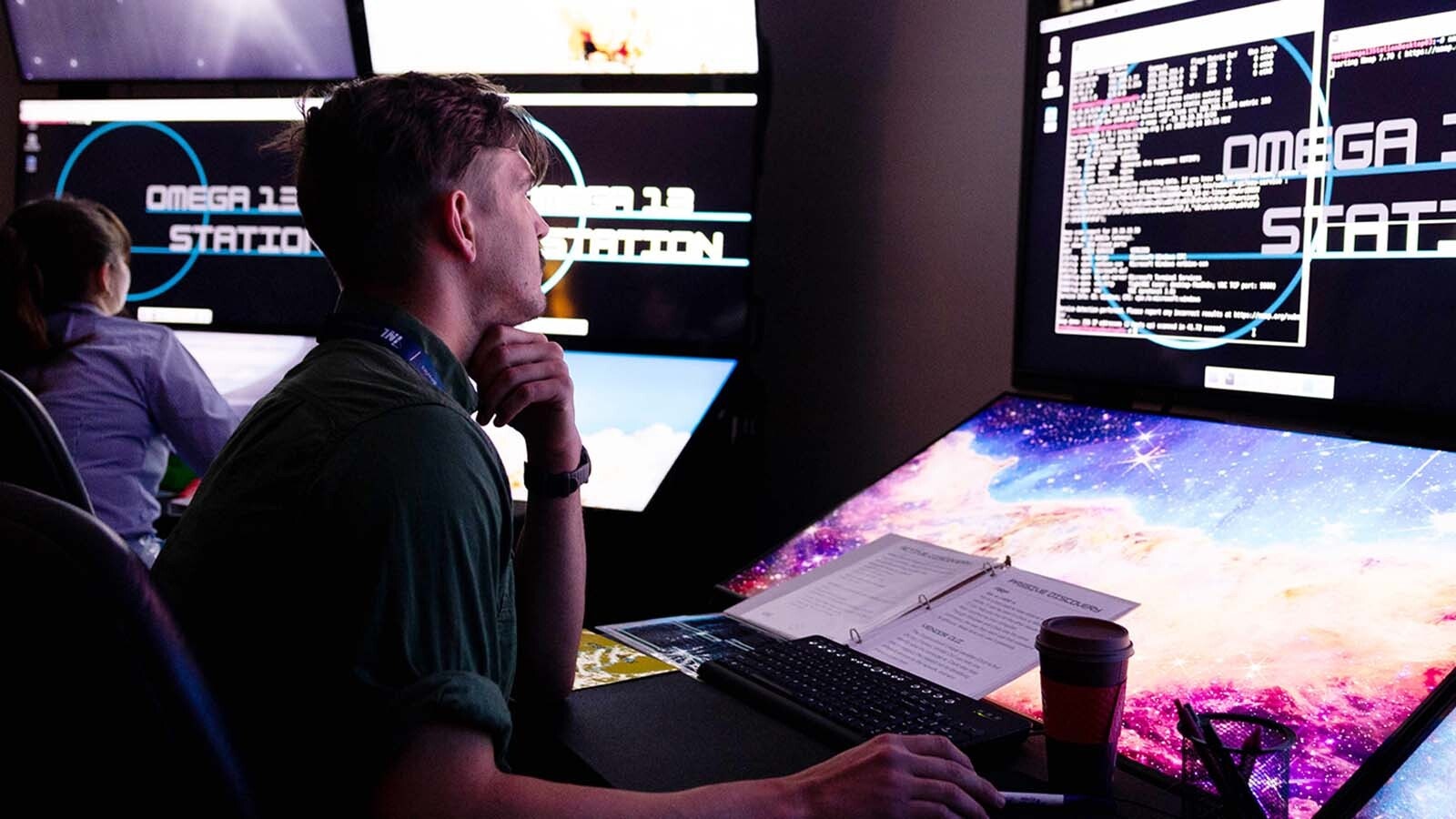 Cybersecurity specialists must figure out the significance of multiple objects and clues in an escape room exercise as part of ICS Cybersecurity Lab Training.