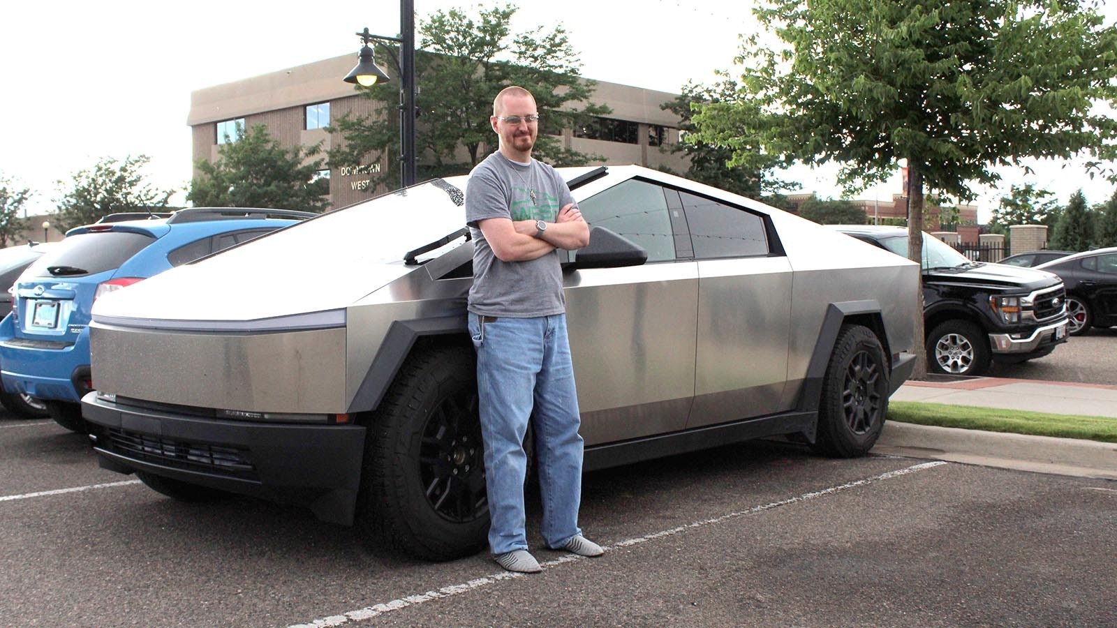 Cheyenne Cybertruck owner TJ Doan loves his new Tesla EV so much he gives Lyft rides in it. While riders love their first Cybertruck experiences, anti-EV people flip him off.