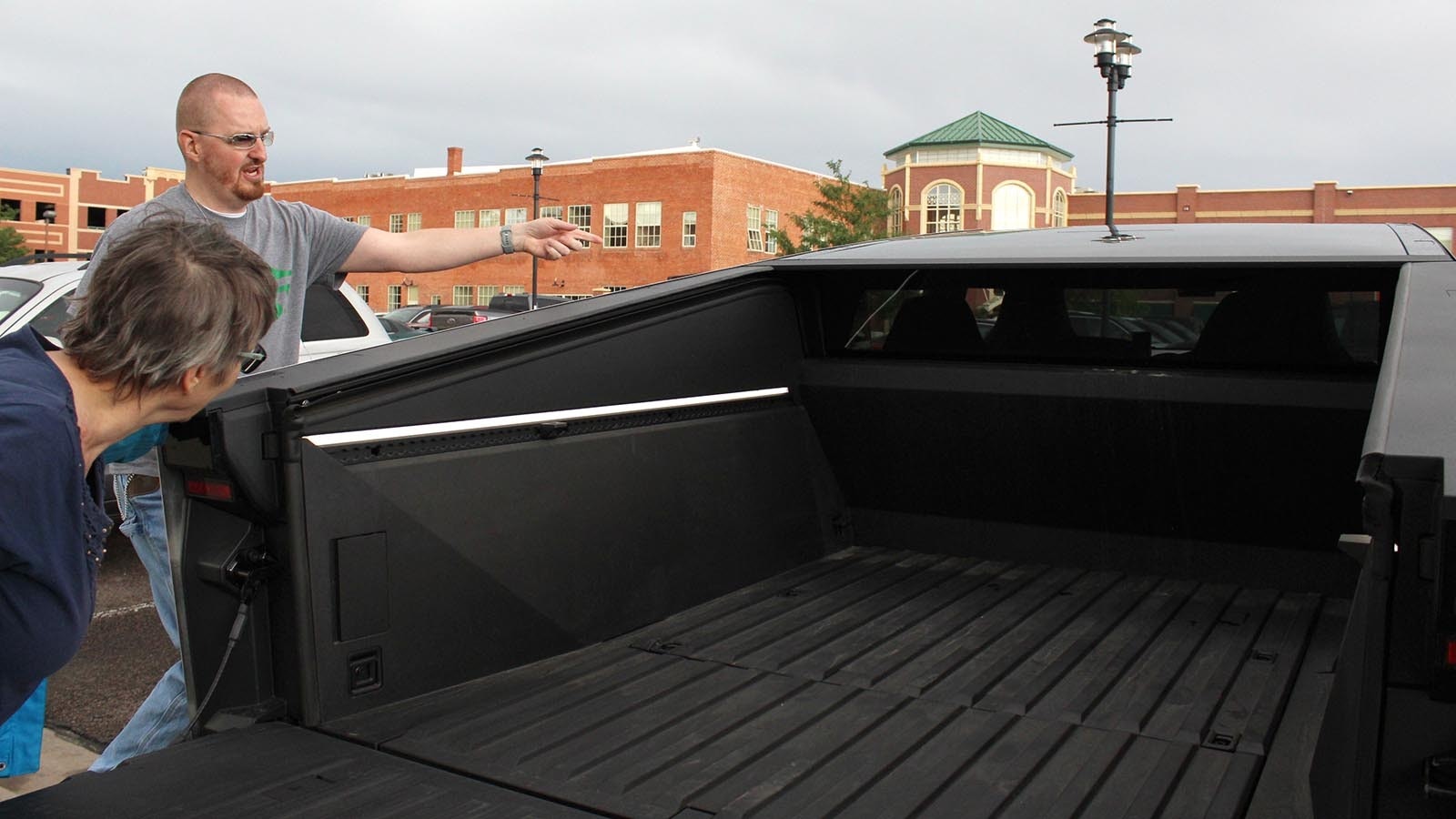 Cheyenne Cybertruck owner TJ Doan loves his new Tesla EV so much he gives Lyft rides in it. While riders love their first Cybertruck experiences, anti-EV people flip him off.