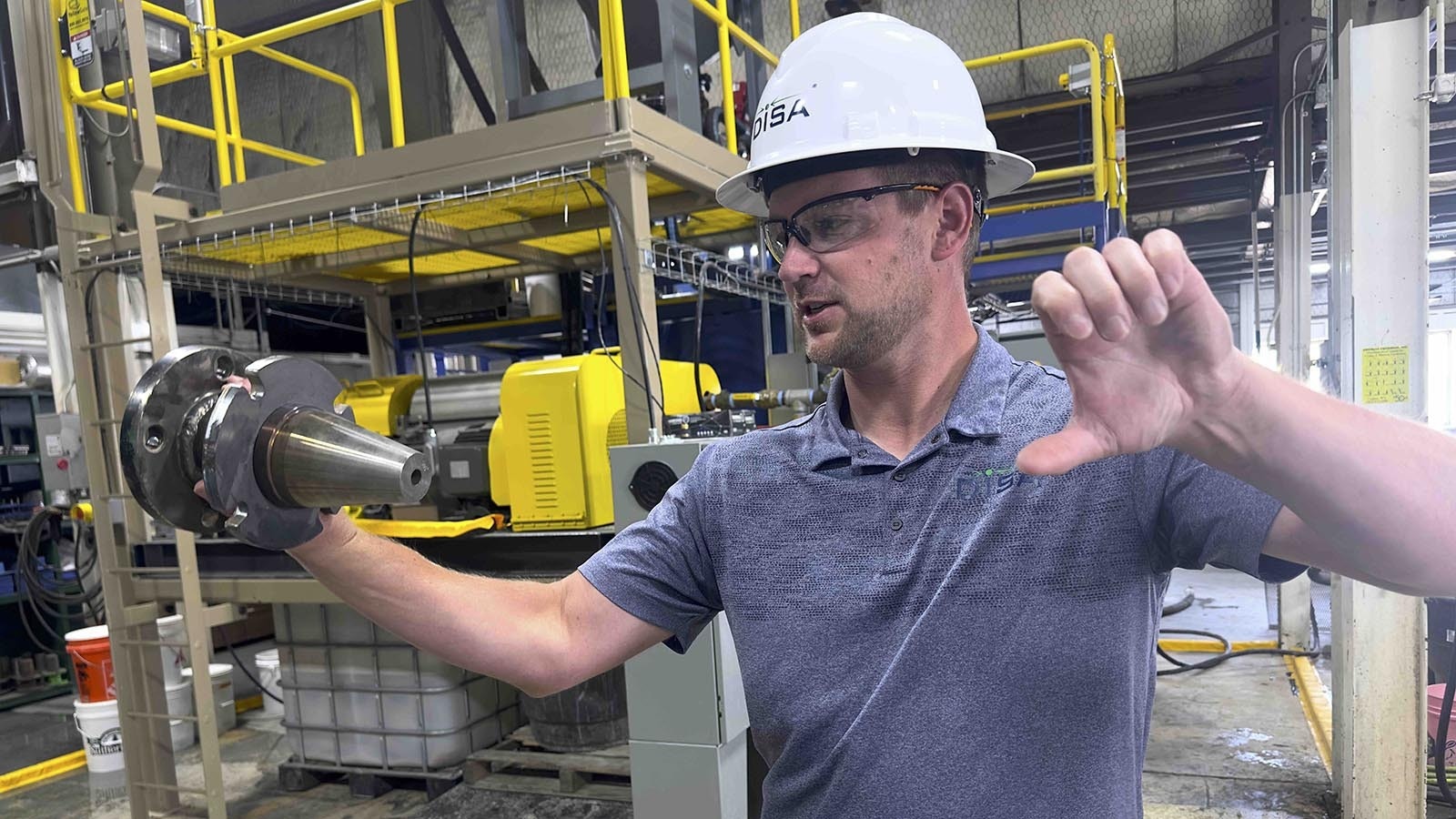 Casper-based mining tech company DISA Technologies uses nozzles, similar to the one held here by Chief Operating Officer John Lee, to blast two jets of mineral-rich slurry at each other to separate critical minerals from ore.