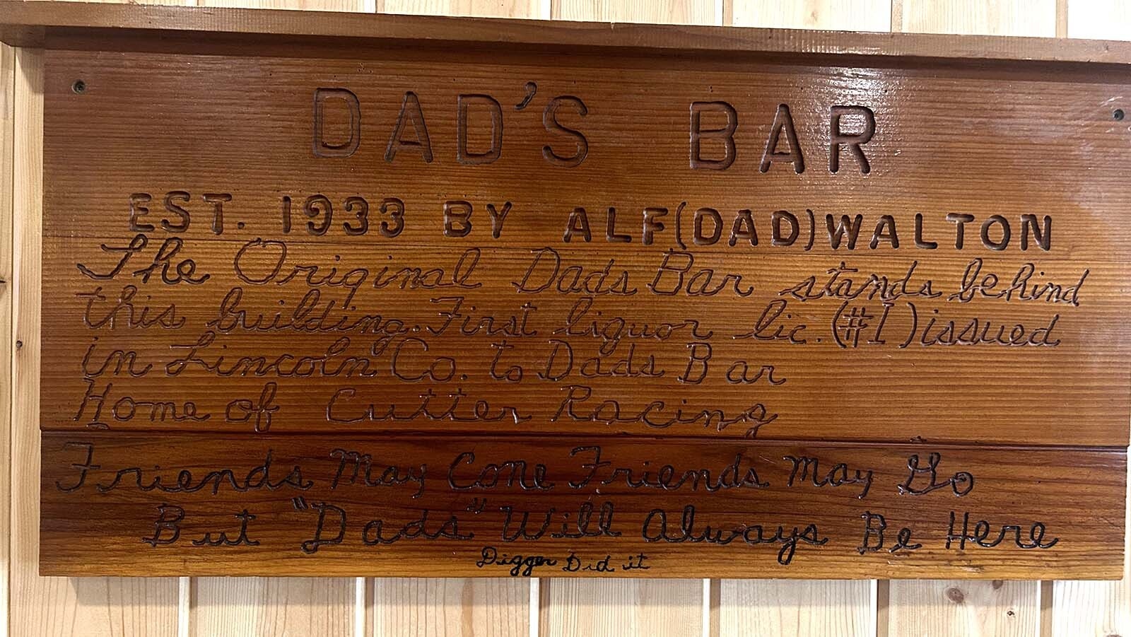 A tribute to the founder of Dad’s Bar, Alf “Dad” Walton hangs on the wall across from the bar.