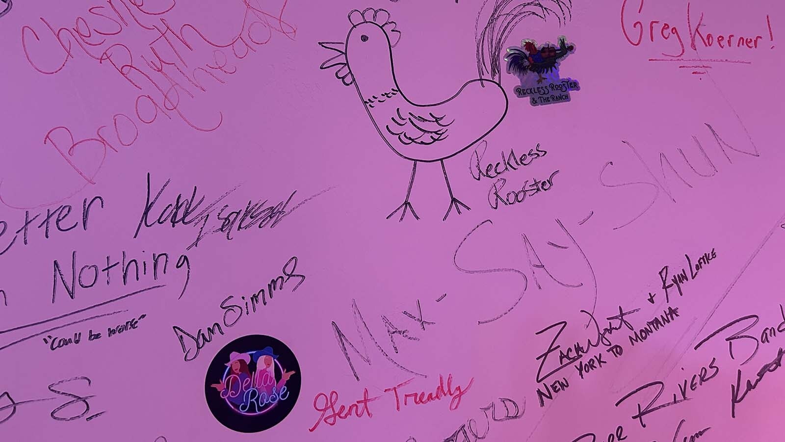 Many musicians have autographed the wall at Dad’s Bar in Thayne.
