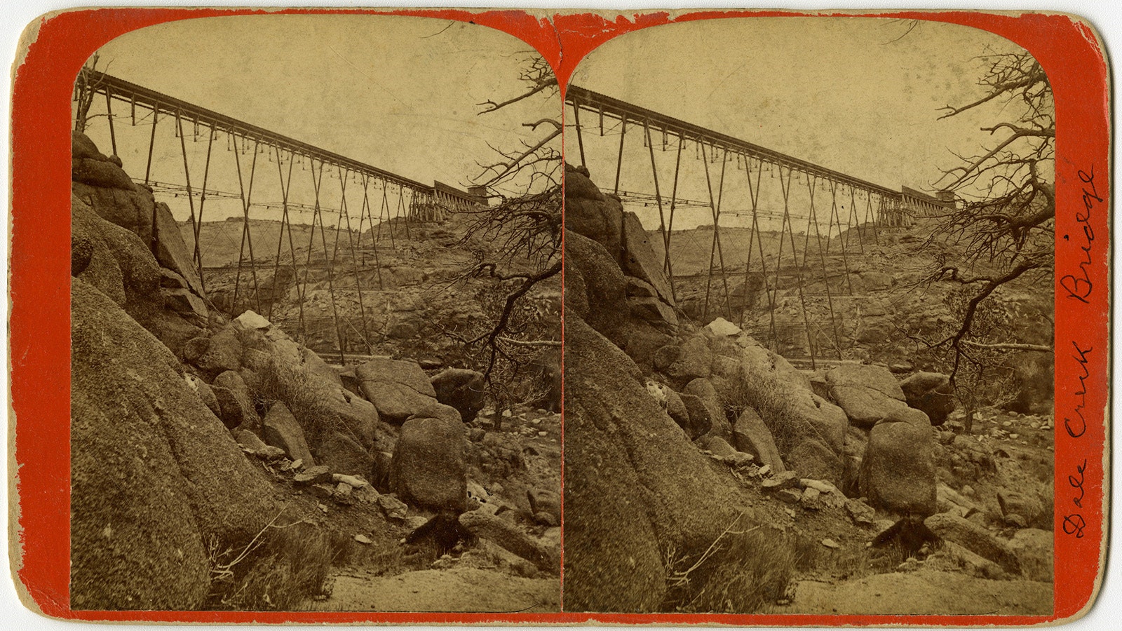 A stereo card by Charles Roscoe Savage showing the second iron Dale Creek Bridge with part of the original wooden trestle is still connected. This was taken in 1876 near Laramie, Wyoming.